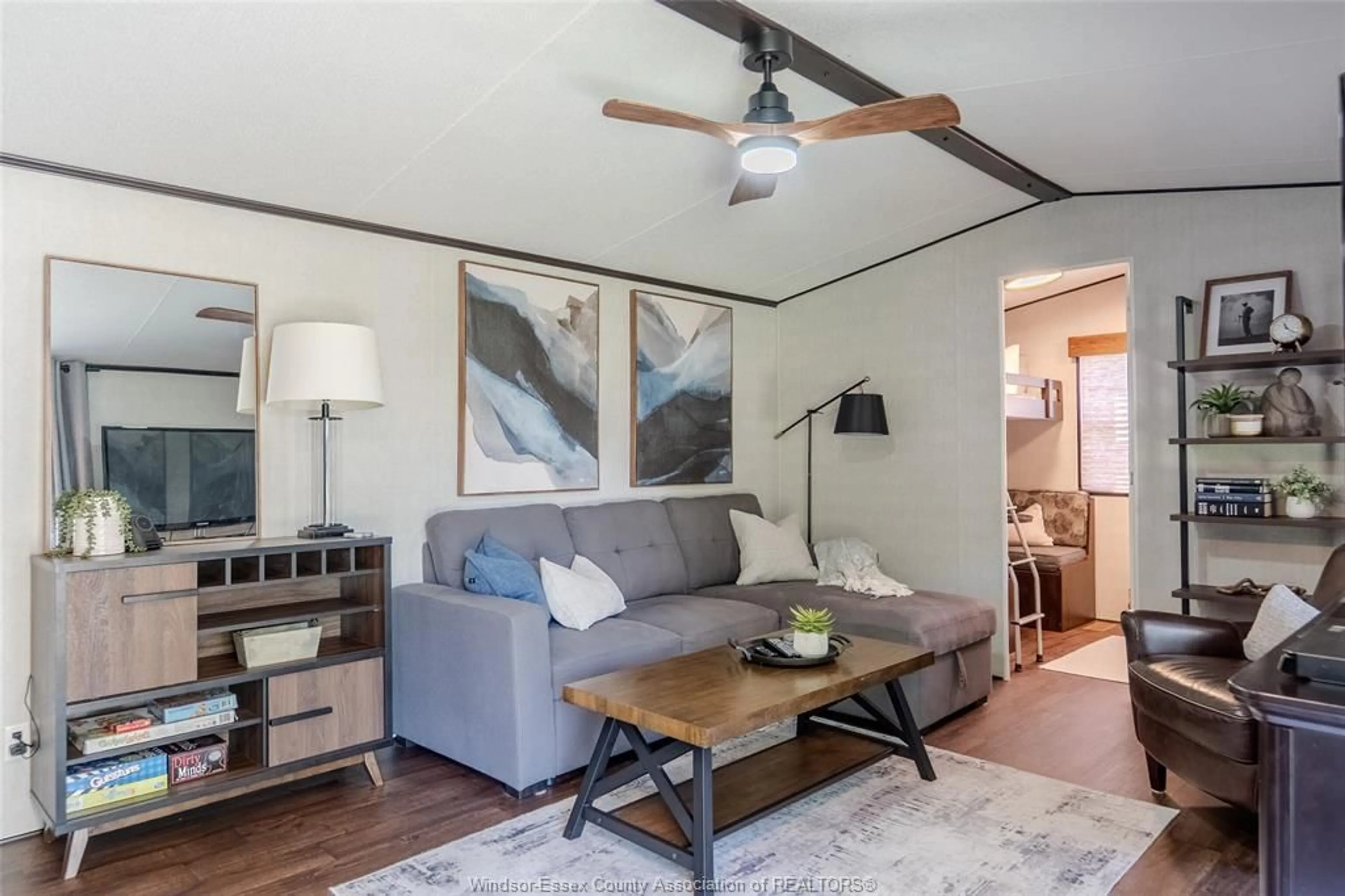 Living room with furniture, wood/laminate floor for 981 COUNTY ROAD 2 #537, Lakeshore Ontario N0R 1A0