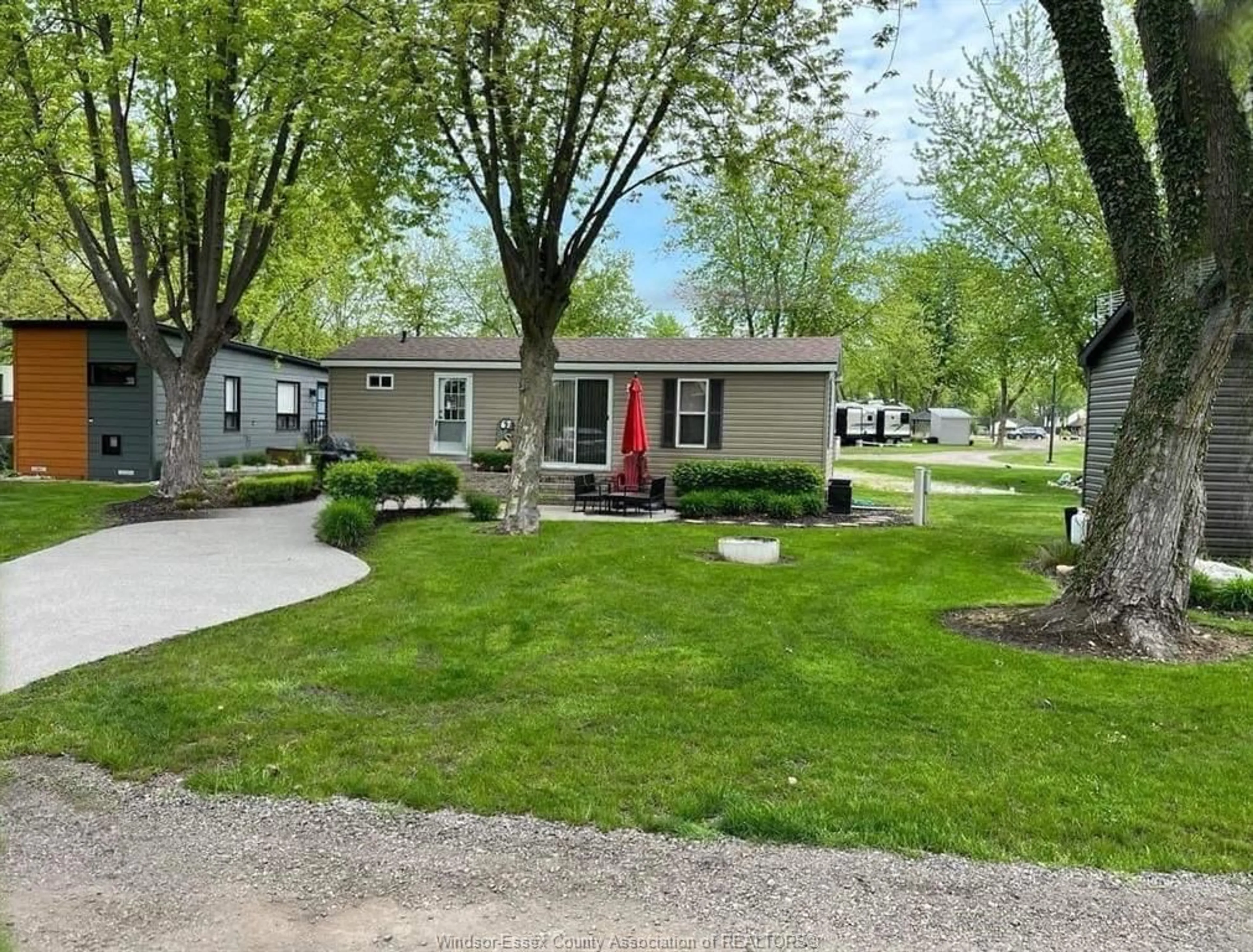 A pic from outside/outdoor area/front of a property/back of a property/a pic from drone, street for 981 COUNTY RD 2 #535, Lakeshore Ontario N8L 1B4