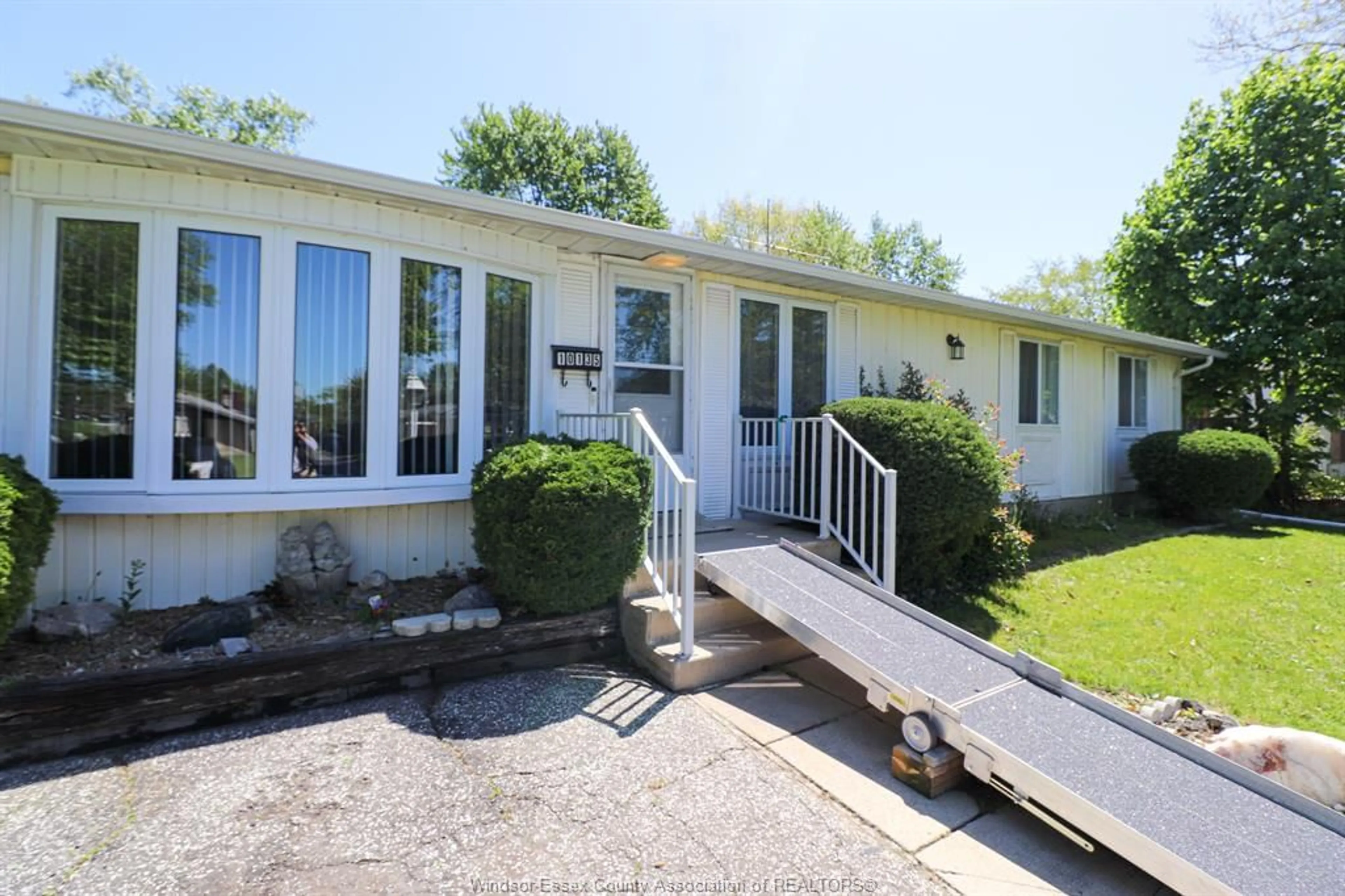 A pic from outside/outdoor area/front of a property/back of a property/a pic from drone, water/lake/river/ocean view for 10135 CALEDON Crt, Windsor Ontario N8R 1C7