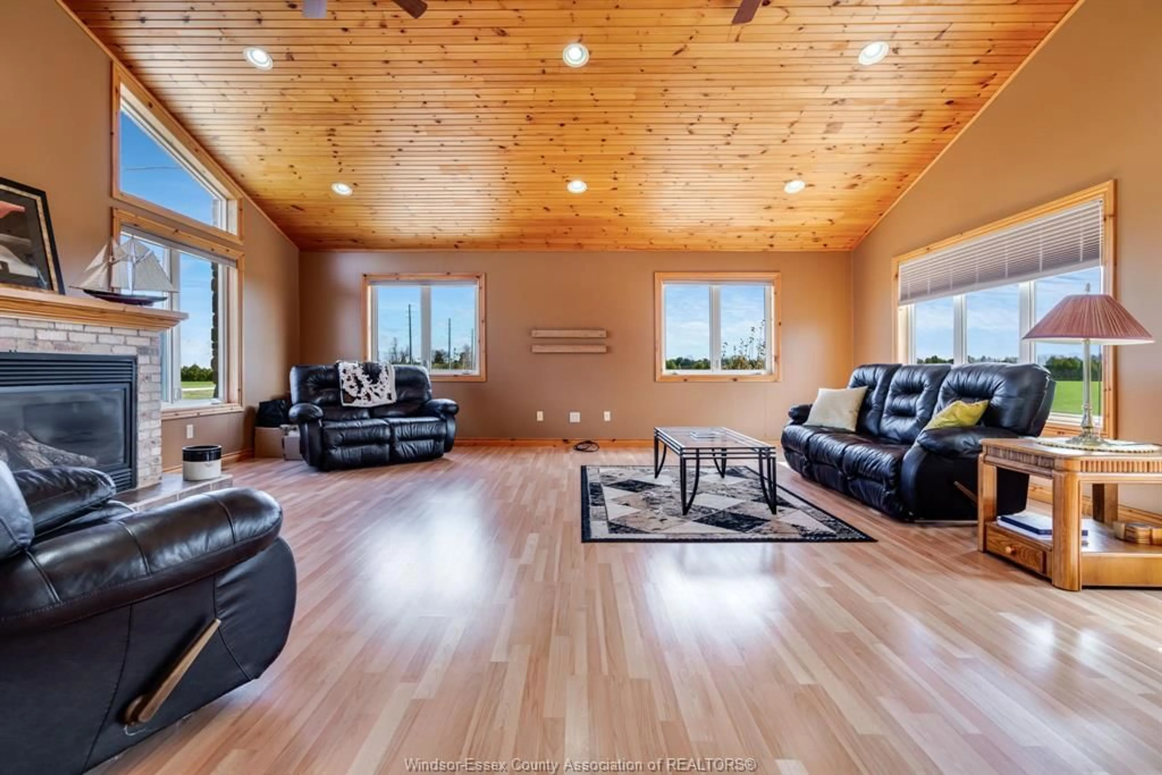 Living room with furniture, wood/laminate floor for 208 Mersea Rd 8, Leamington Ontario N8H 3V8