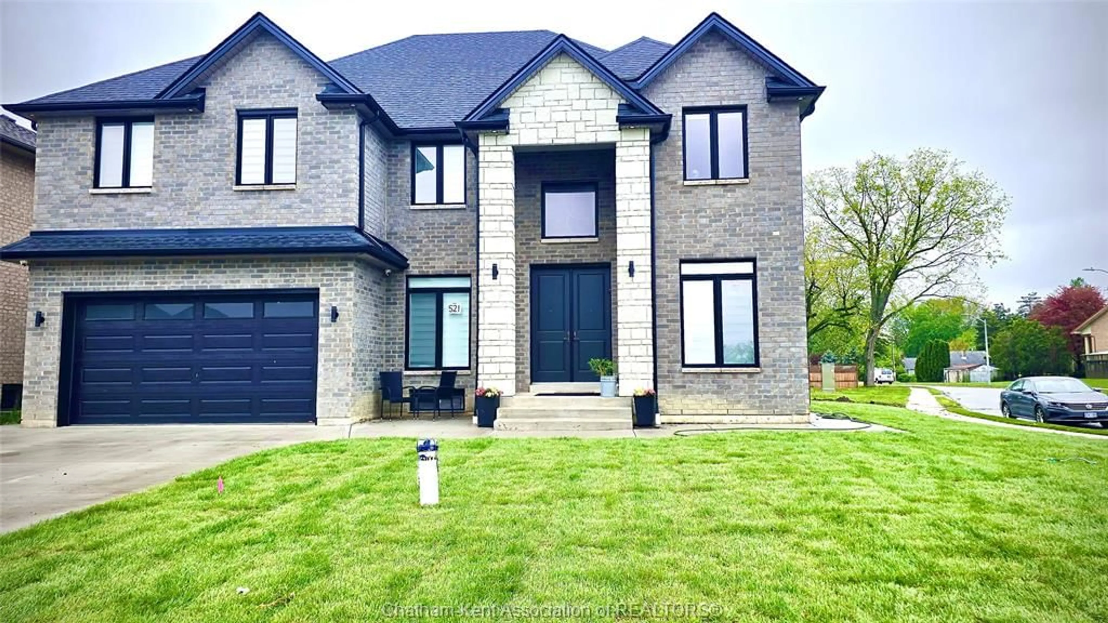 Home with brick exterior material, street for 521 Orchards Cres, Windsor Ontario N9E 0B2