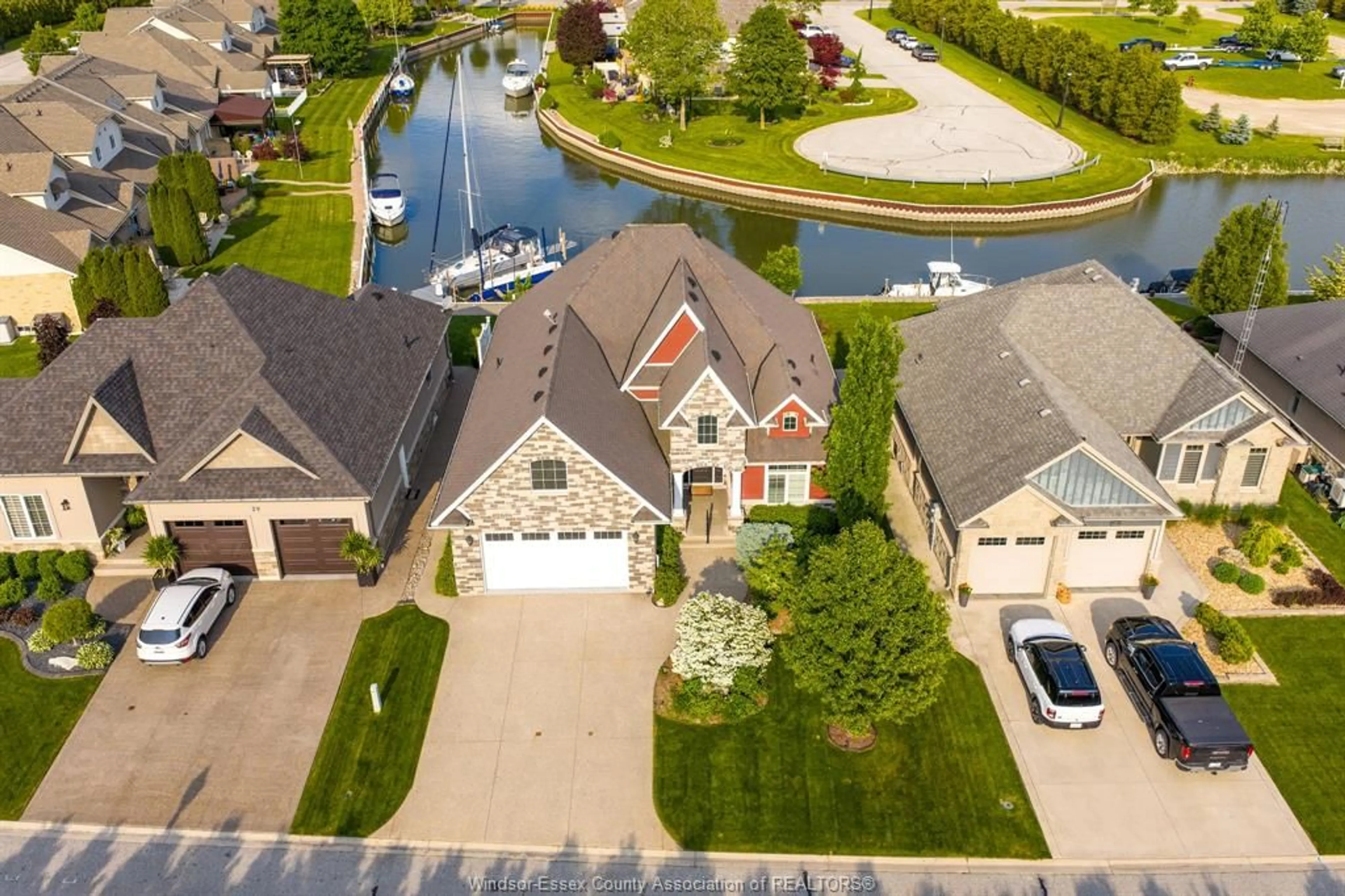 A pic from outside/outdoor area/front of a property/back of a property/a pic from drone, water/lake/river/ocean view for 33 Montego Bay Cres, Kingsville Ontario N9Y 4E7