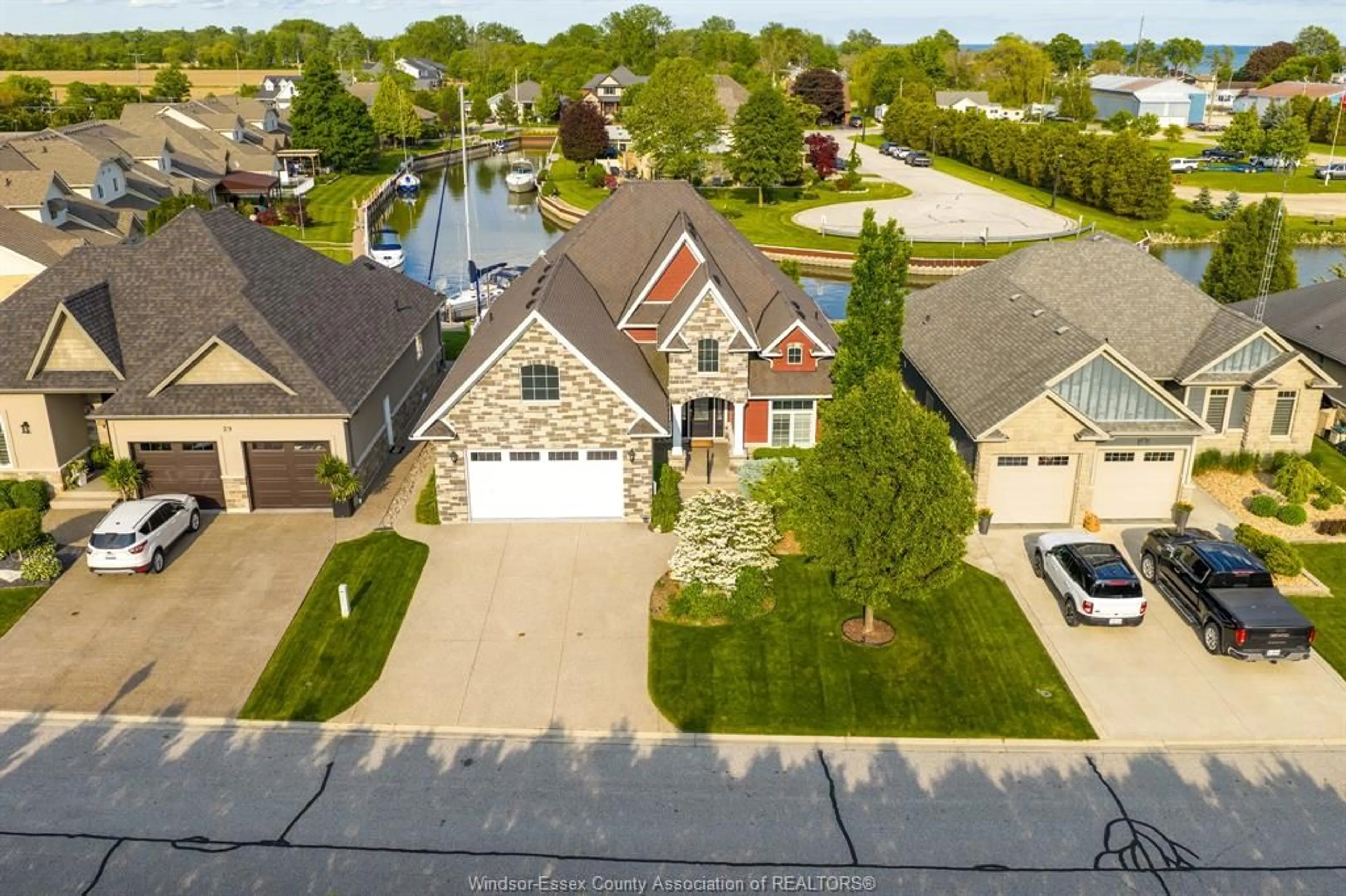 A pic from outside/outdoor area/front of a property/back of a property/a pic from drone, street for 33 Montego Bay Cres, Kingsville Ontario N9Y 4E7