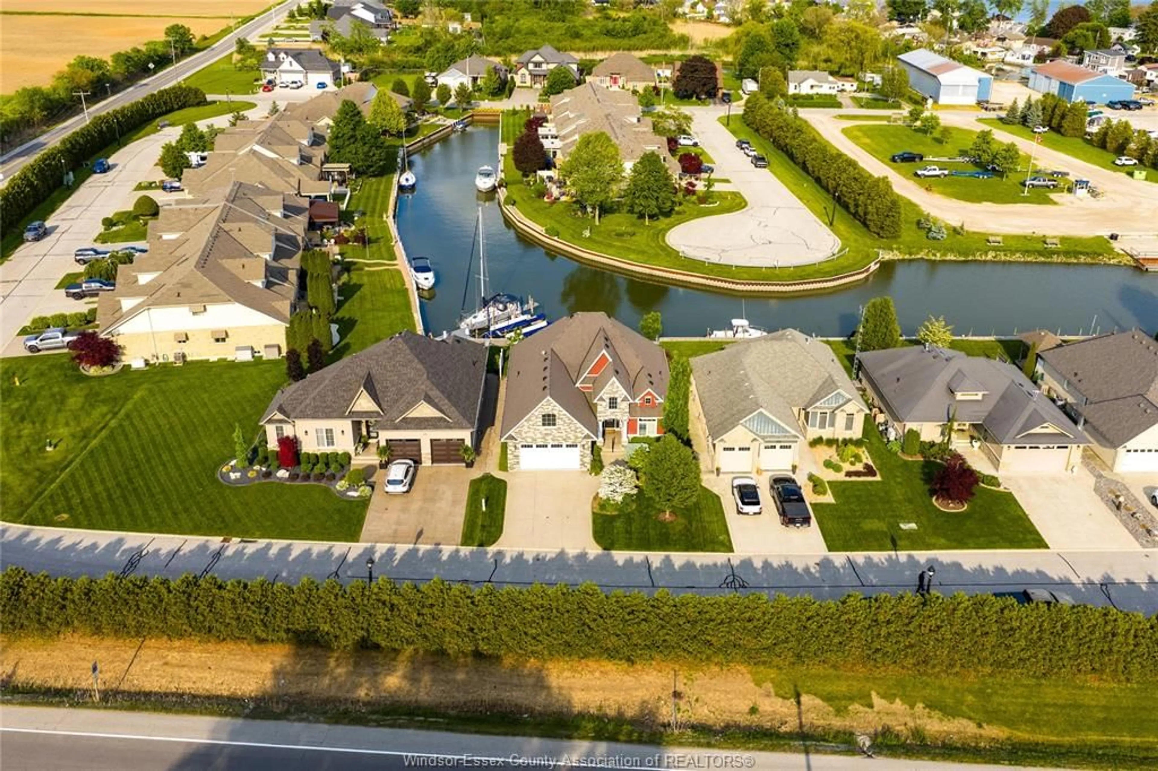 A pic from outside/outdoor area/front of a property/back of a property/a pic from drone, water/lake/river/ocean view for 33 Montego Bay Cres, Kingsville Ontario N9Y 4E7