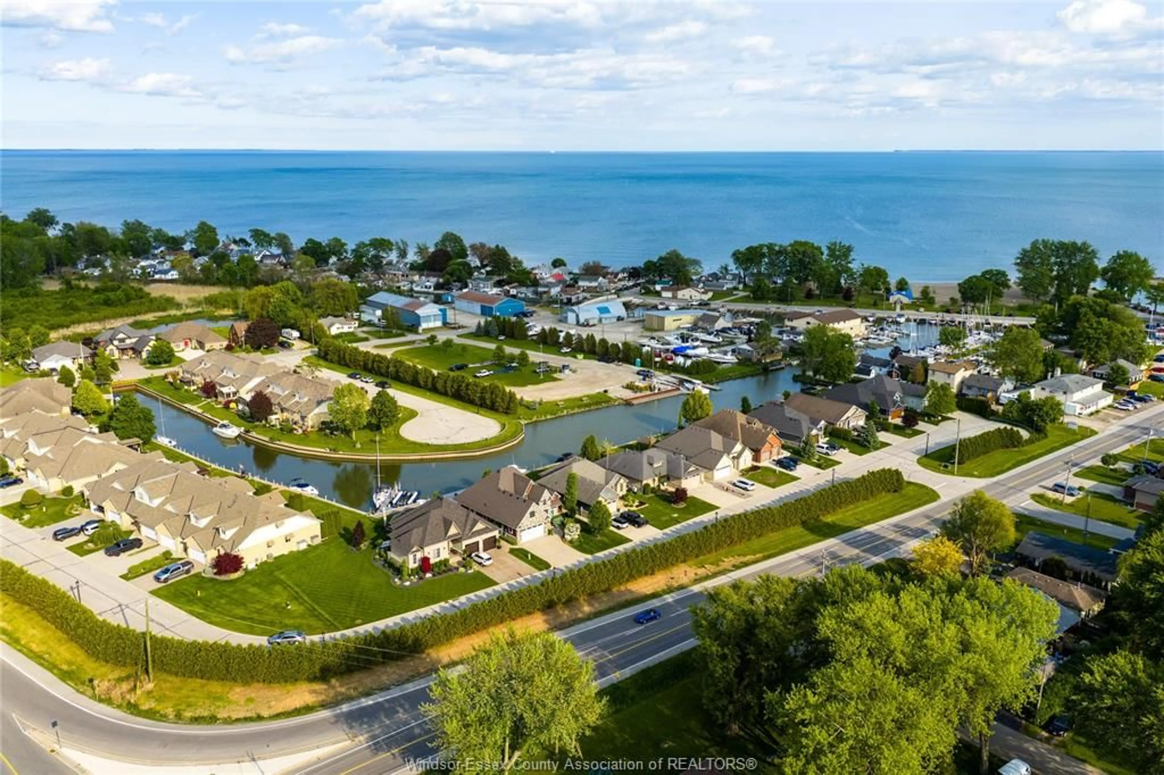 A pic from outside/outdoor area/front of a property/back of a property/a pic from drone, water/lake/river/ocean view for 33 Montego Bay Cres, Kingsville Ontario N9Y 4E7