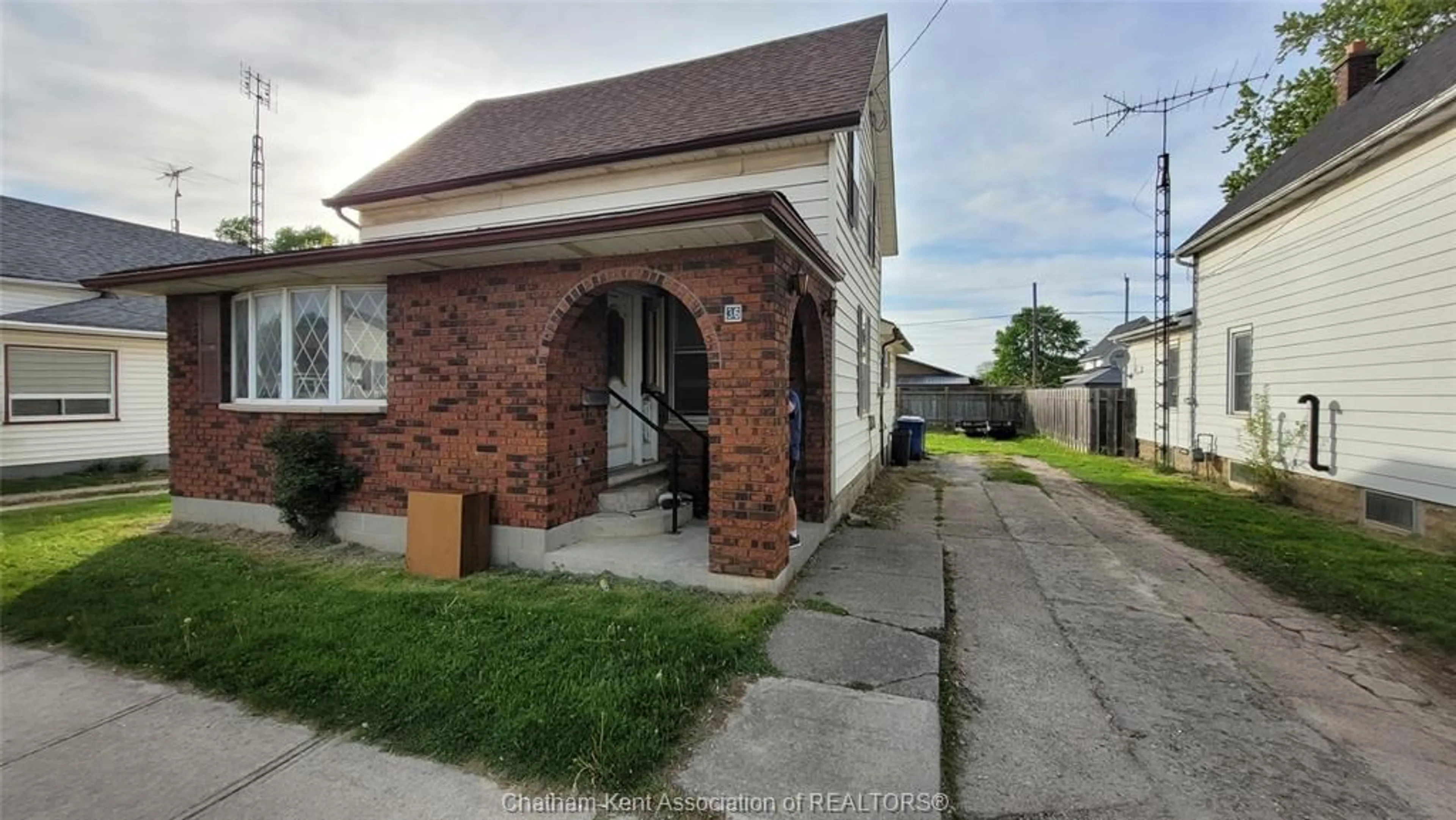 Home with brick exterior material, street for 36 Gillard St, Wallaceburg Ontario N8A 1M7
