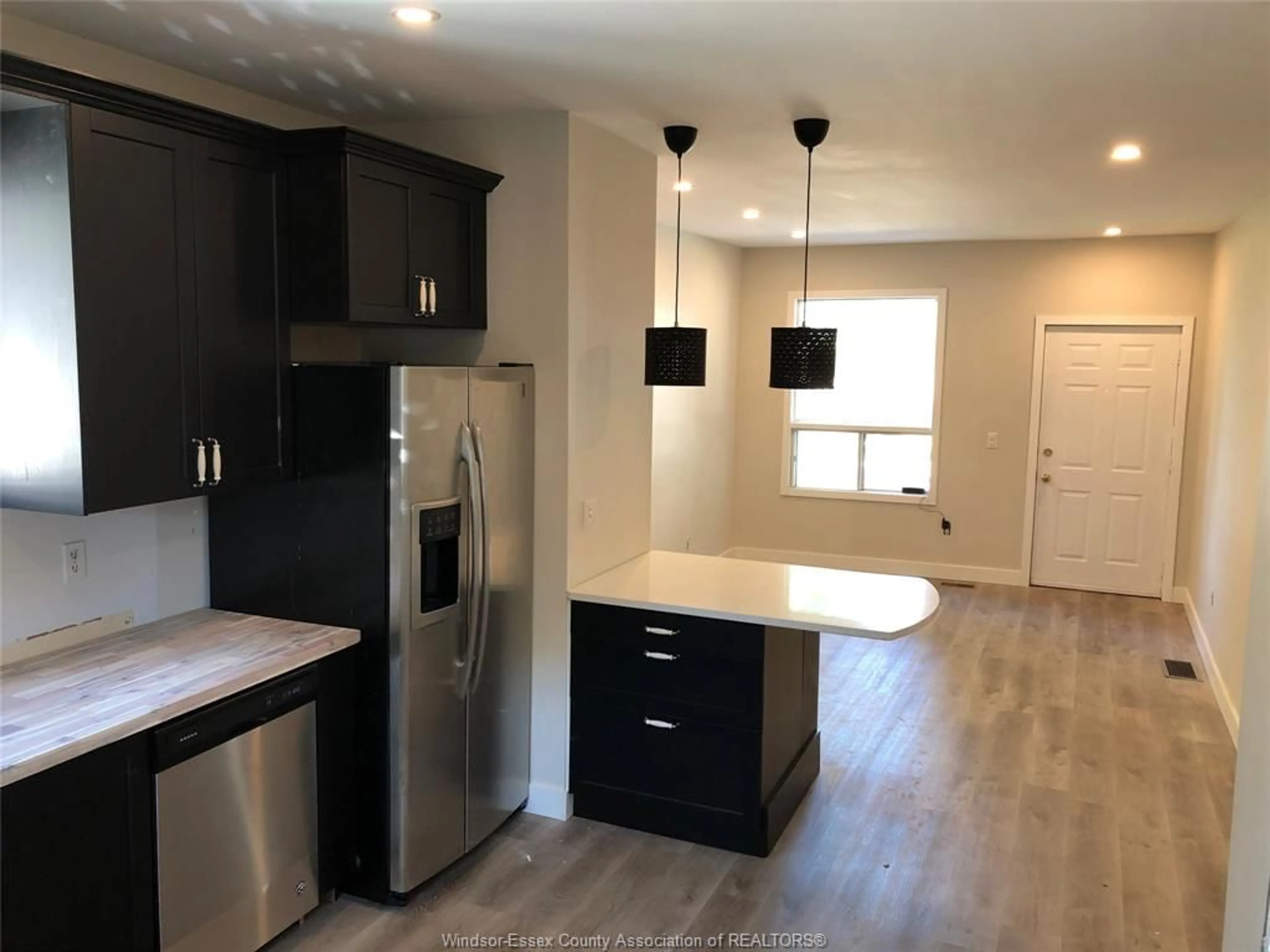 Open concept kitchen, wood/laminate floor for 439 Chilver Rd, Windsor Ontario N8Y 2J8