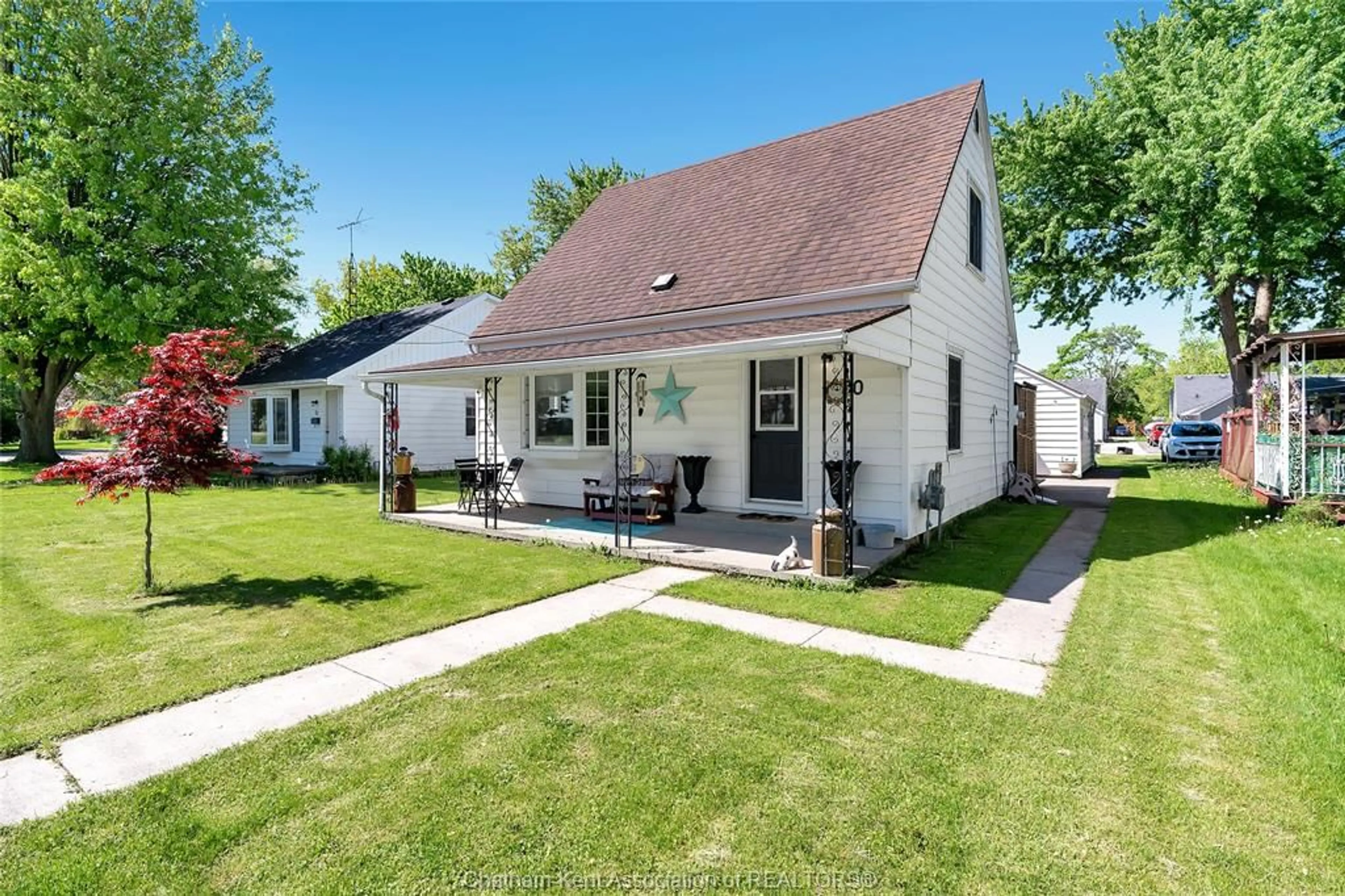 Home with vinyl exterior material, street for 50 Ella St, Tilbury Ontario N0P 2L0