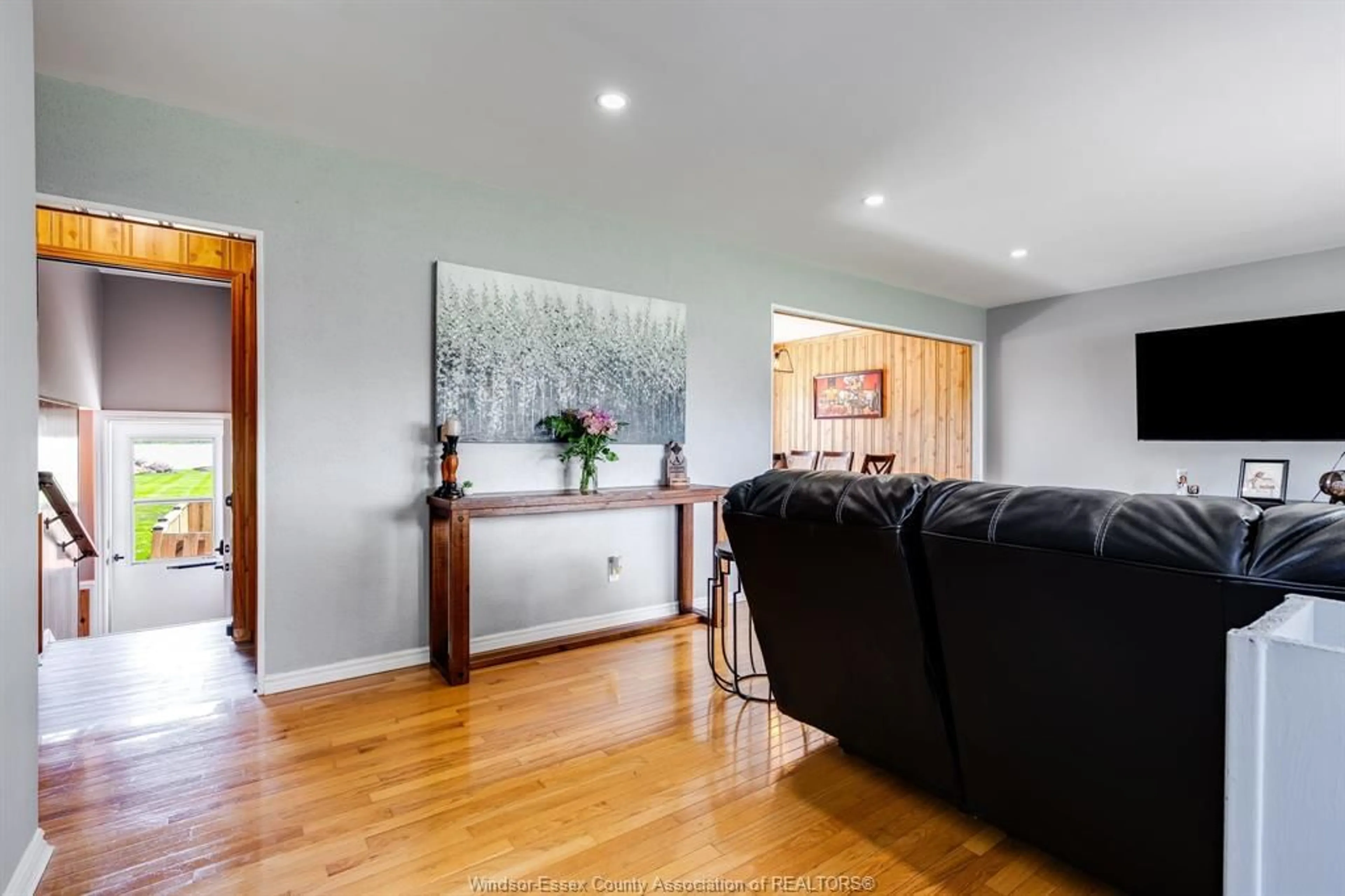 Living room with furniture, wood/laminate floor for 2940 County Rd 27, Woodslee Ontario N0R 1V0