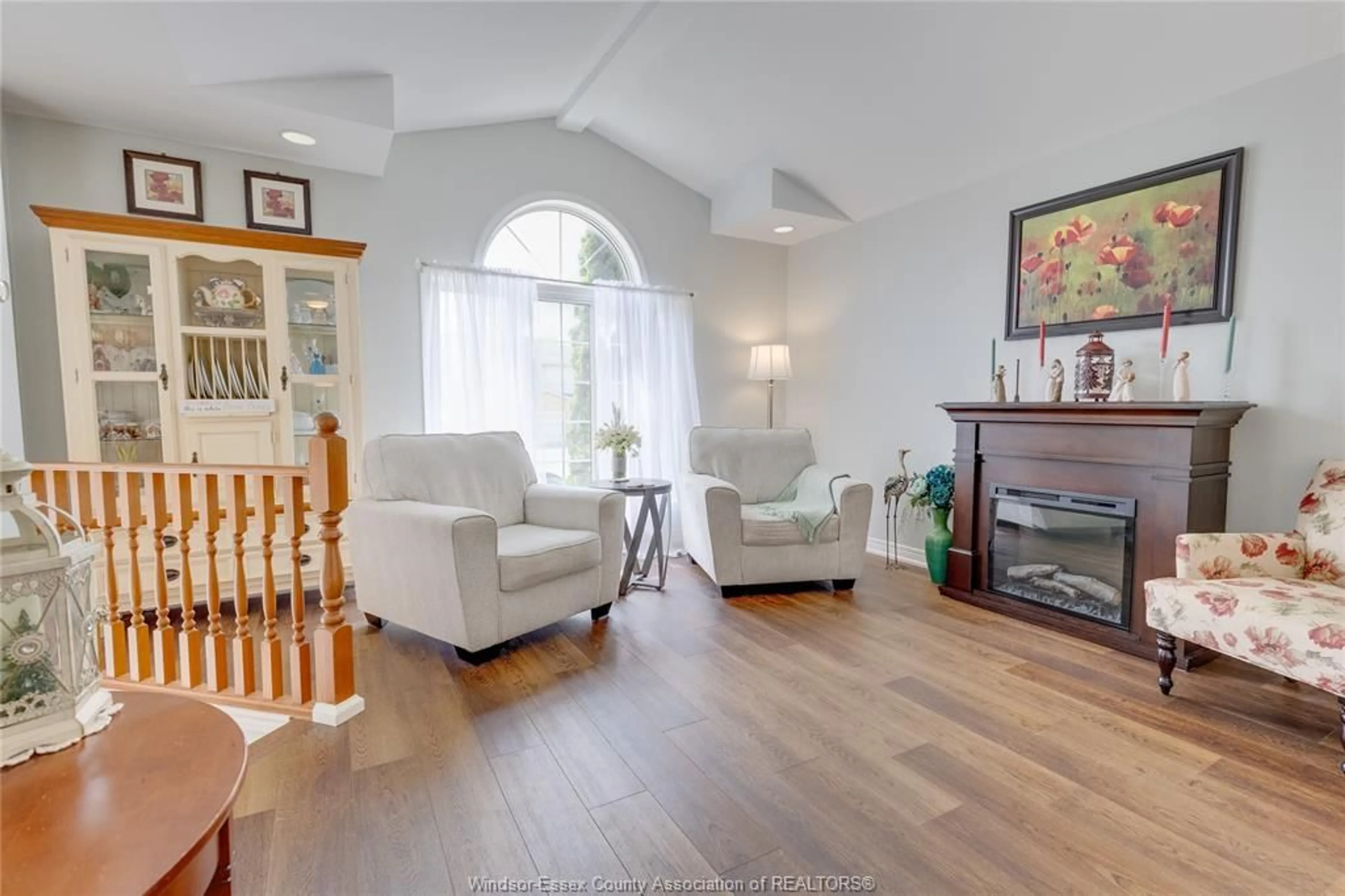 Living room with furniture, wood/laminate floor for 12586 HORWOOD Cres, Tecumseh Ontario N8N 4T7