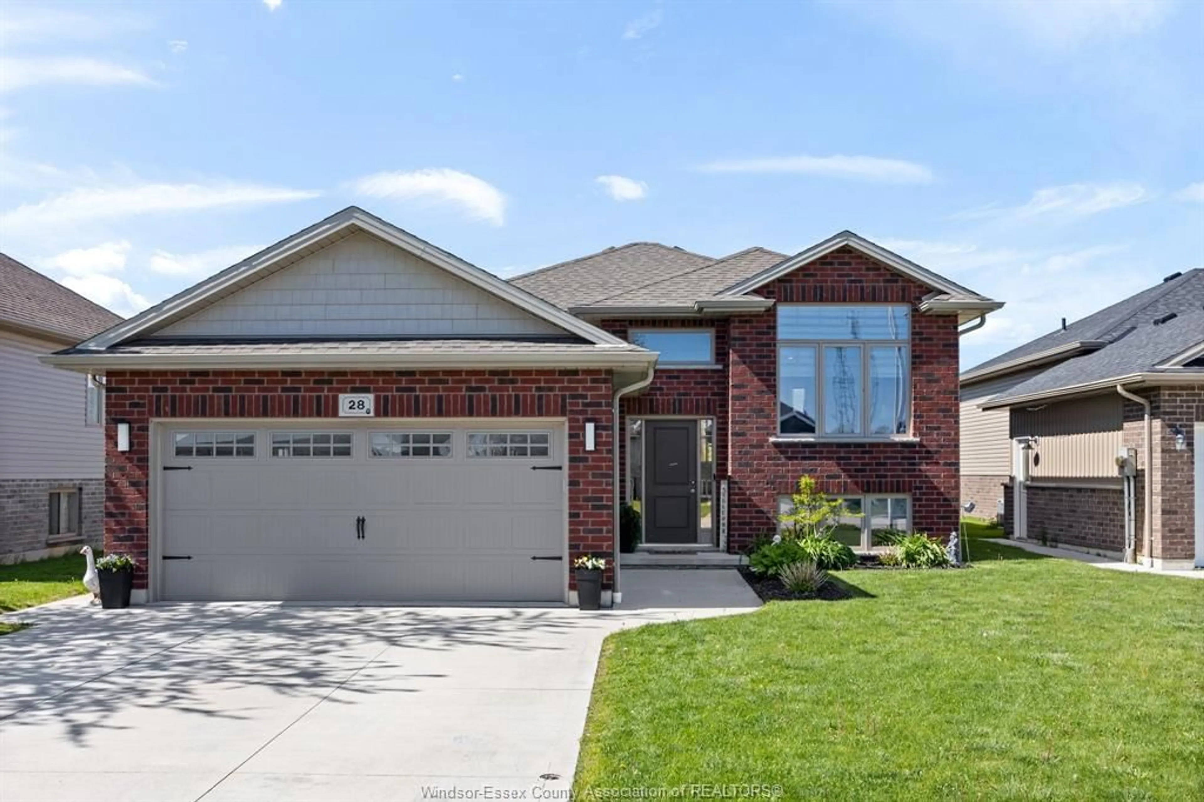 Home with brick exterior material, street for 28 REGAL Dr, Tilbury Ontario N0P 2L0