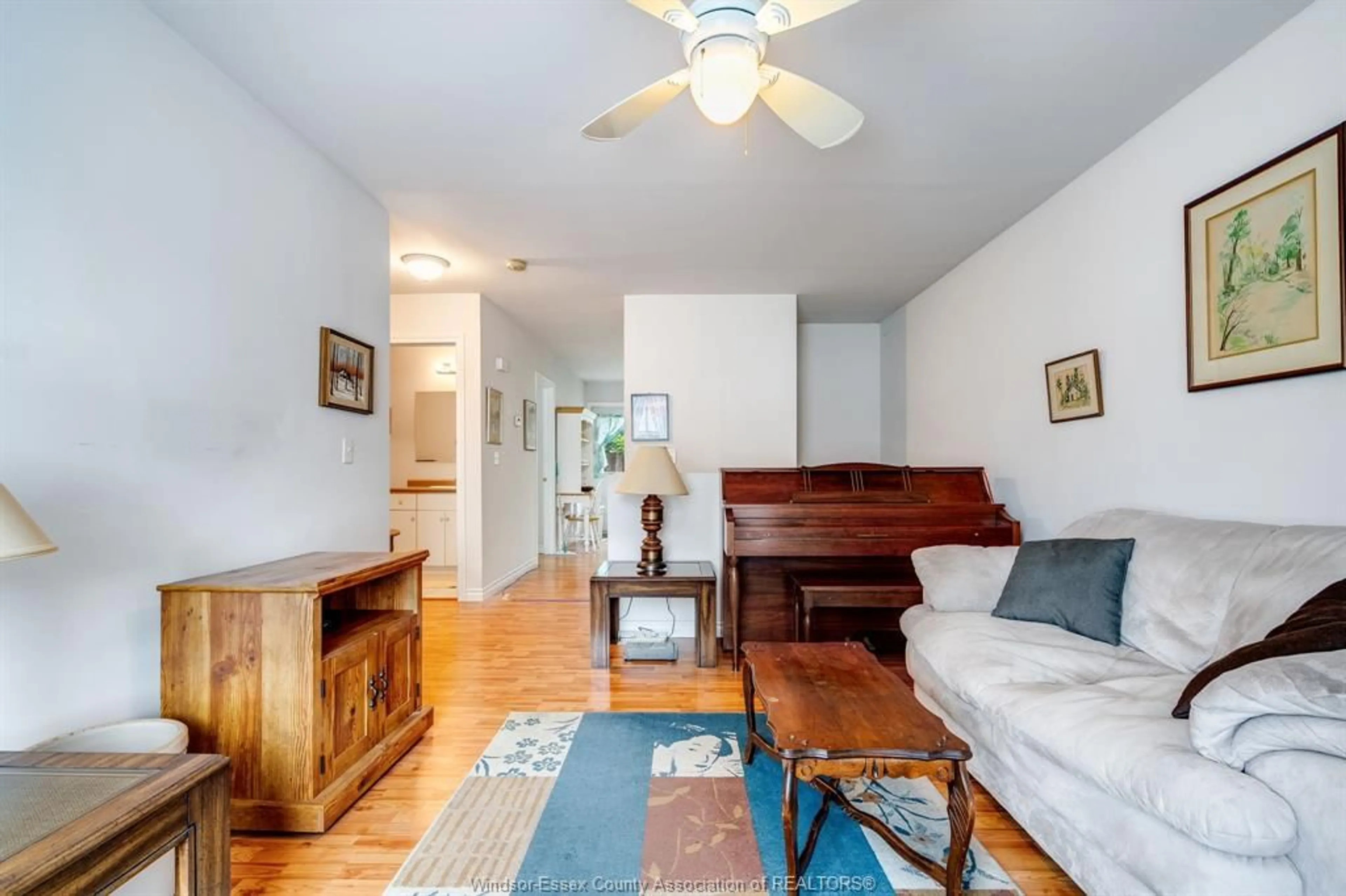 Living room with furniture, wood/laminate floor for 22 LINDA Crt, Tilbury Ontario N0P 2L0