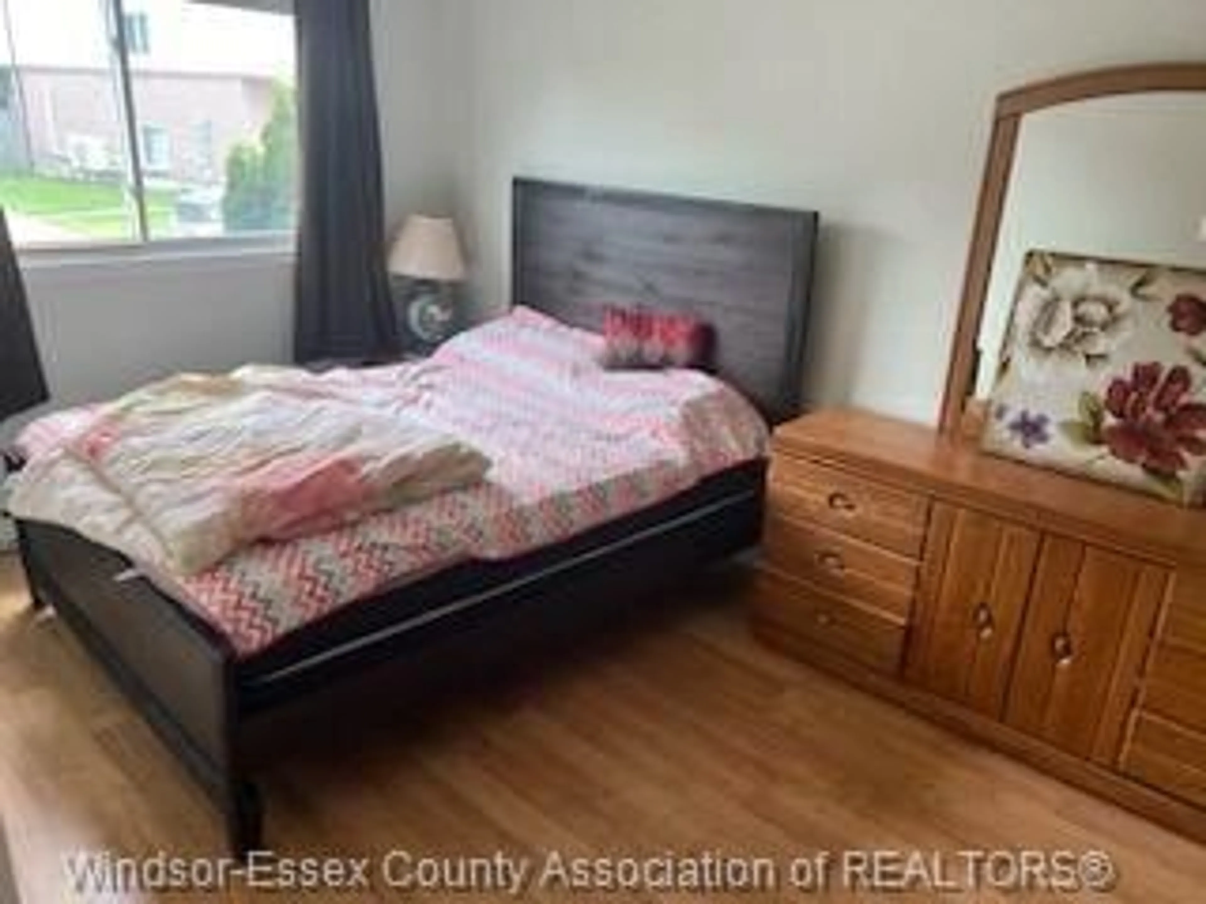 Bedroom with bed, wood/laminate floor for 8270 Gateside Place, Windsor Ontario N8S 4N6