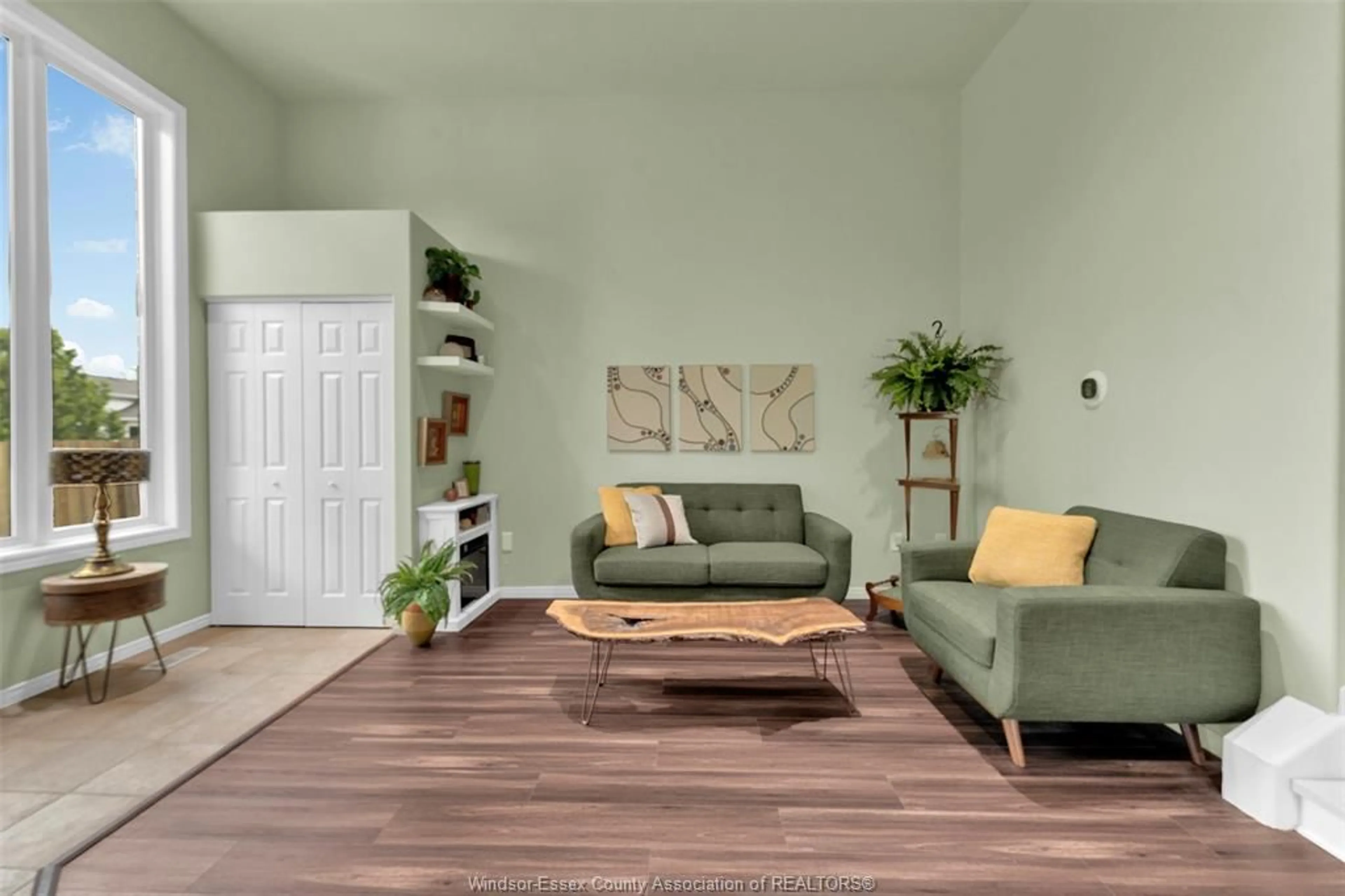 Living room with furniture, wood/laminate floor for 3579 Innerkip Cres, Windsor Ontario N8W 5V1