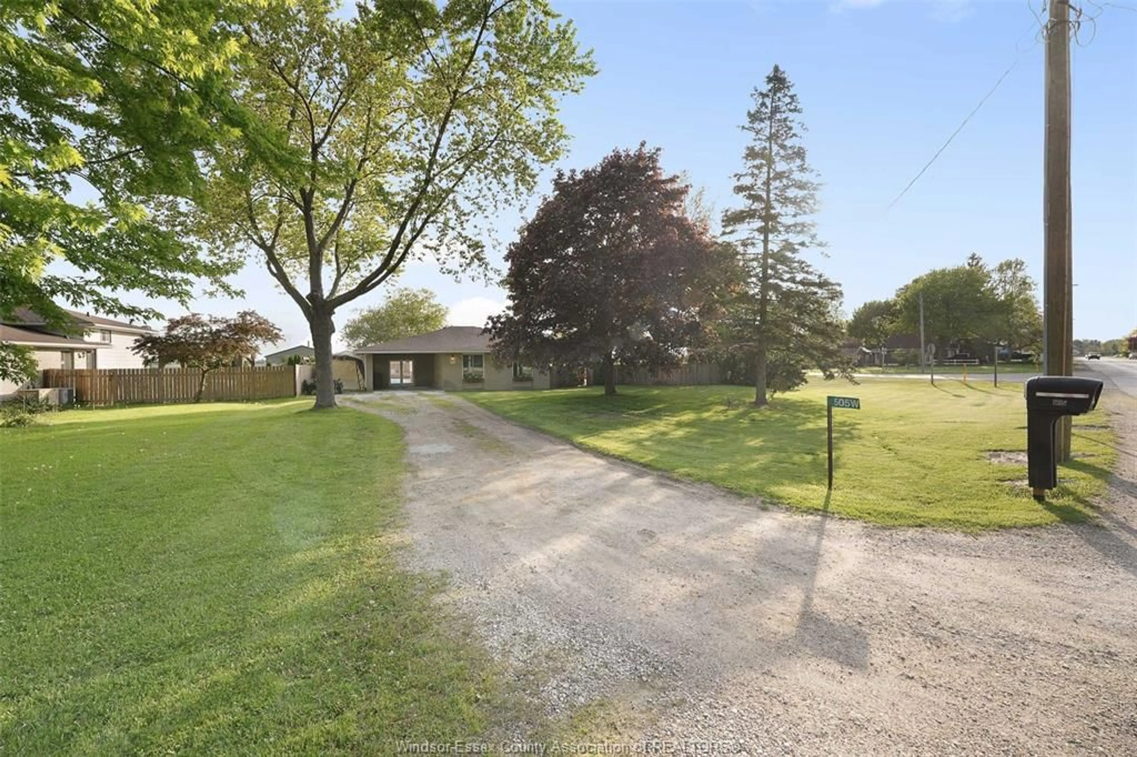A pic from outside/outdoor area/front of a property/back of a property/a pic from drone, street for 505 COUNTY RD 34, Kingsville Ontario N8M 2X5
