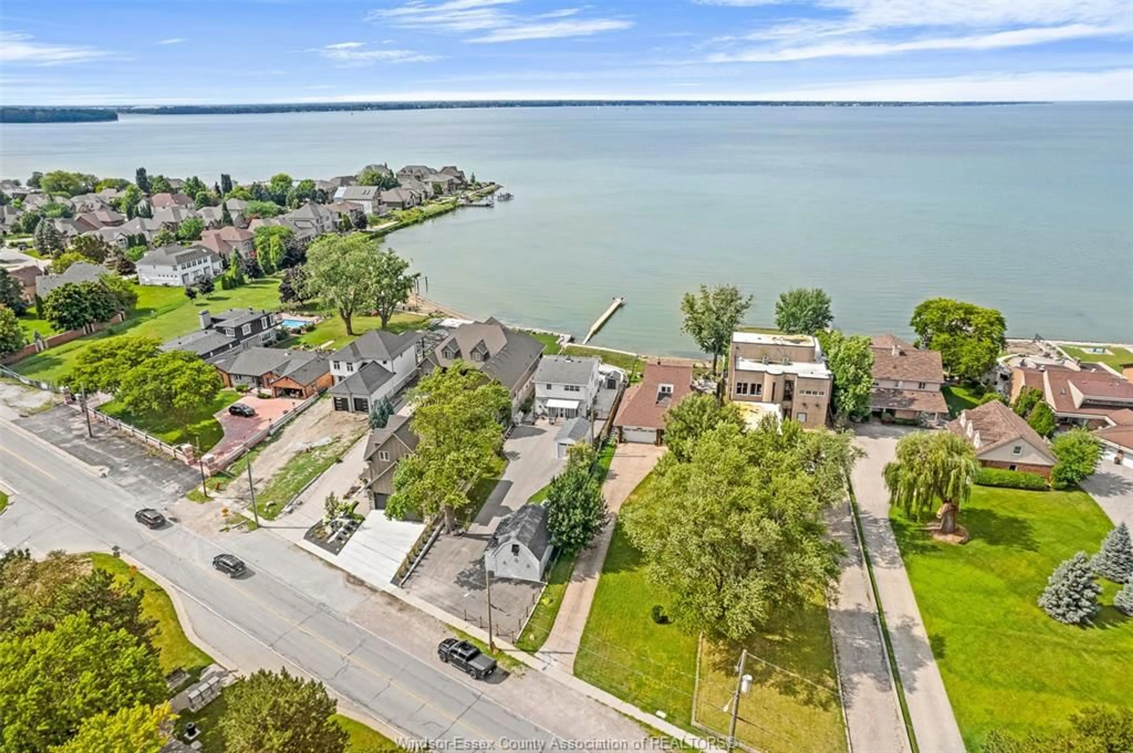 A pic from outside/outdoor area/front of a property/back of a property/a pic from drone, water/lake/river/ocean view for 12086 RIVERSIDE Dr, Tecumseh Ontario N8P 1A9