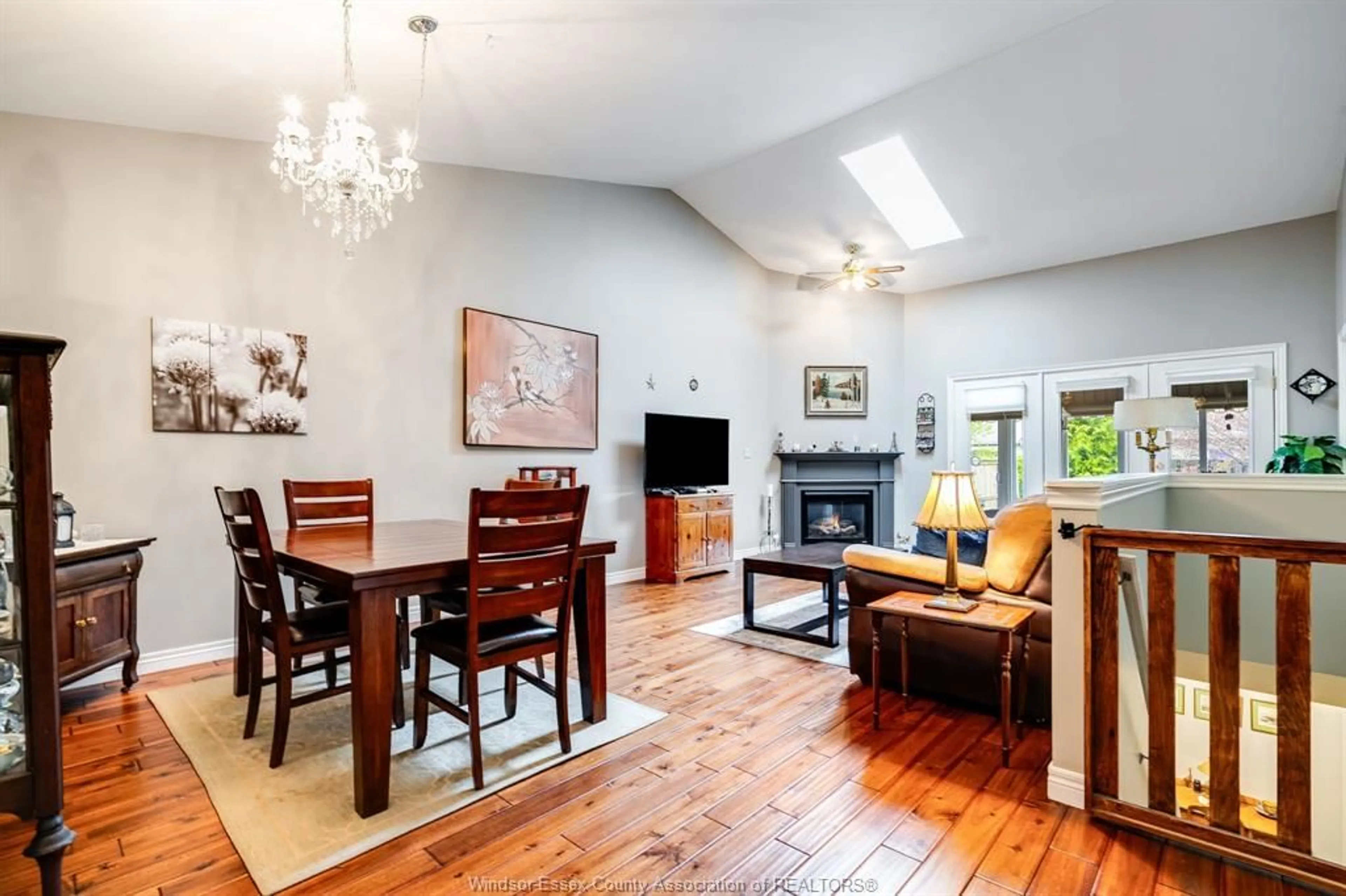 Living room with furniture, wood/laminate floor for 12 LEONARD Dr, Kingsville Ontario N9Y 4G4