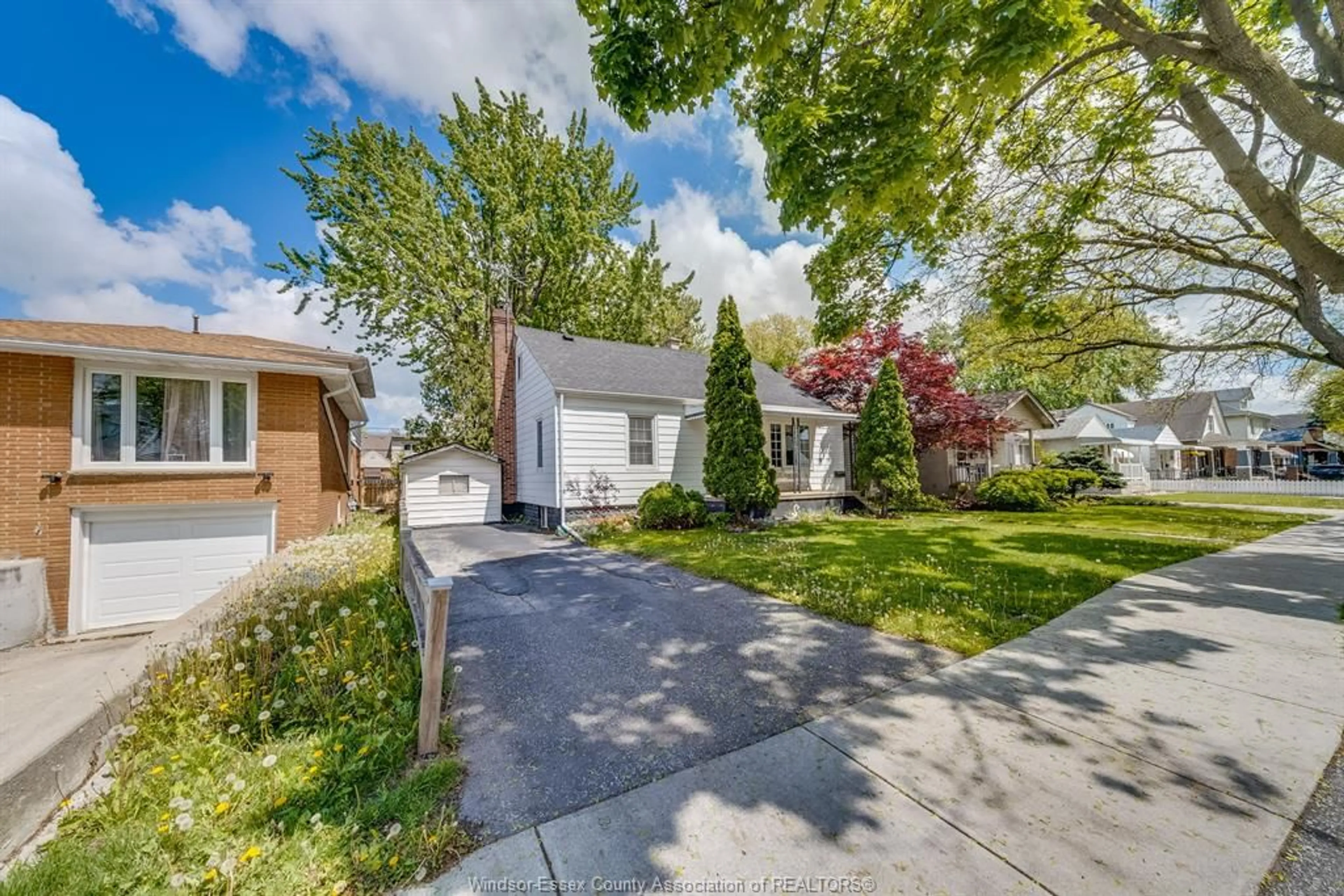 A pic from outside/outdoor area/front of a property/back of a property/a pic from drone, street for 1418 PILLETTE Rd, Windsor Ontario N8Y 3B9