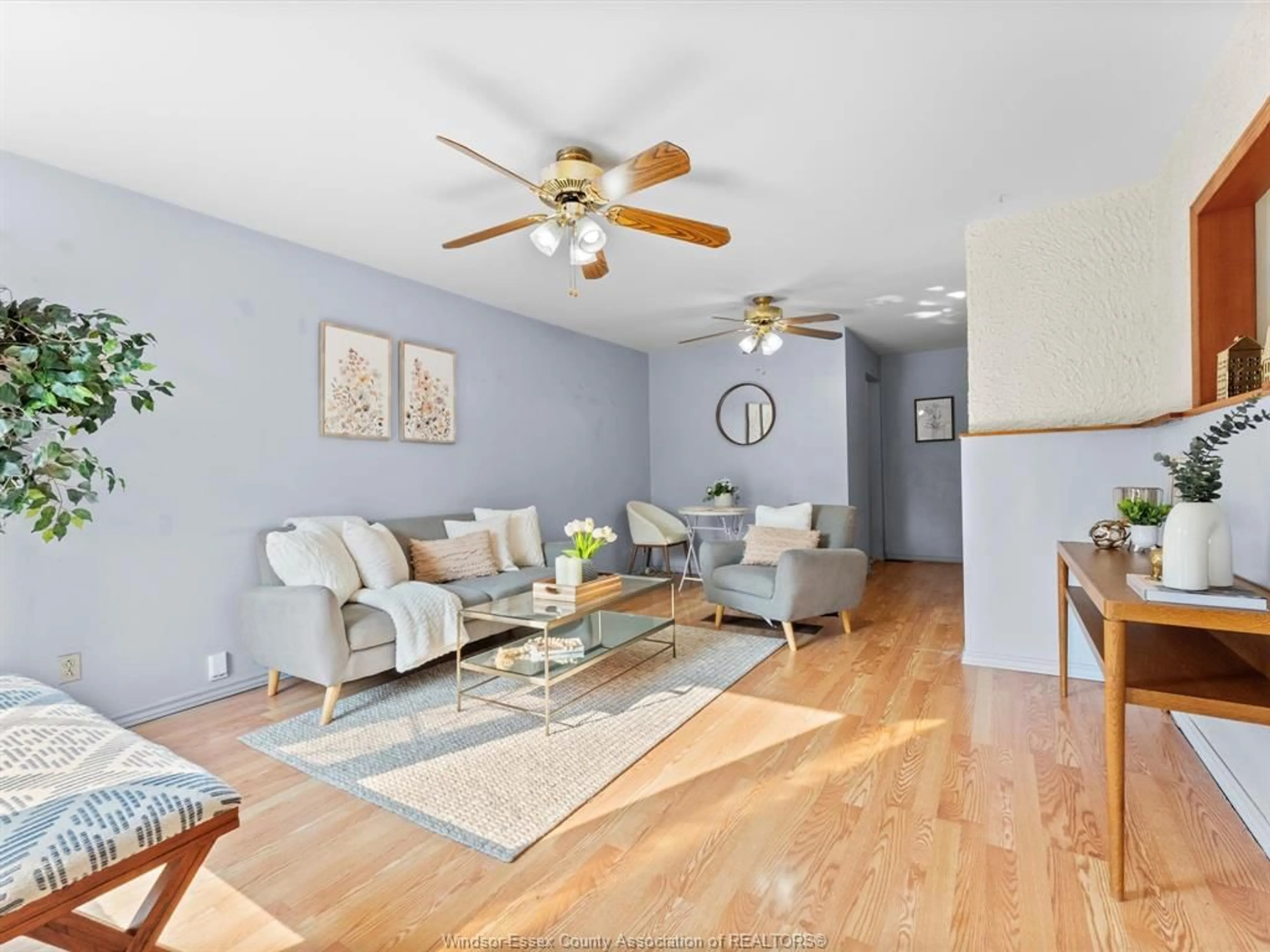 Living room with furniture, wood/laminate floor for 1561 Drouillard Rd, Windsor Ontario N8Y 2S1