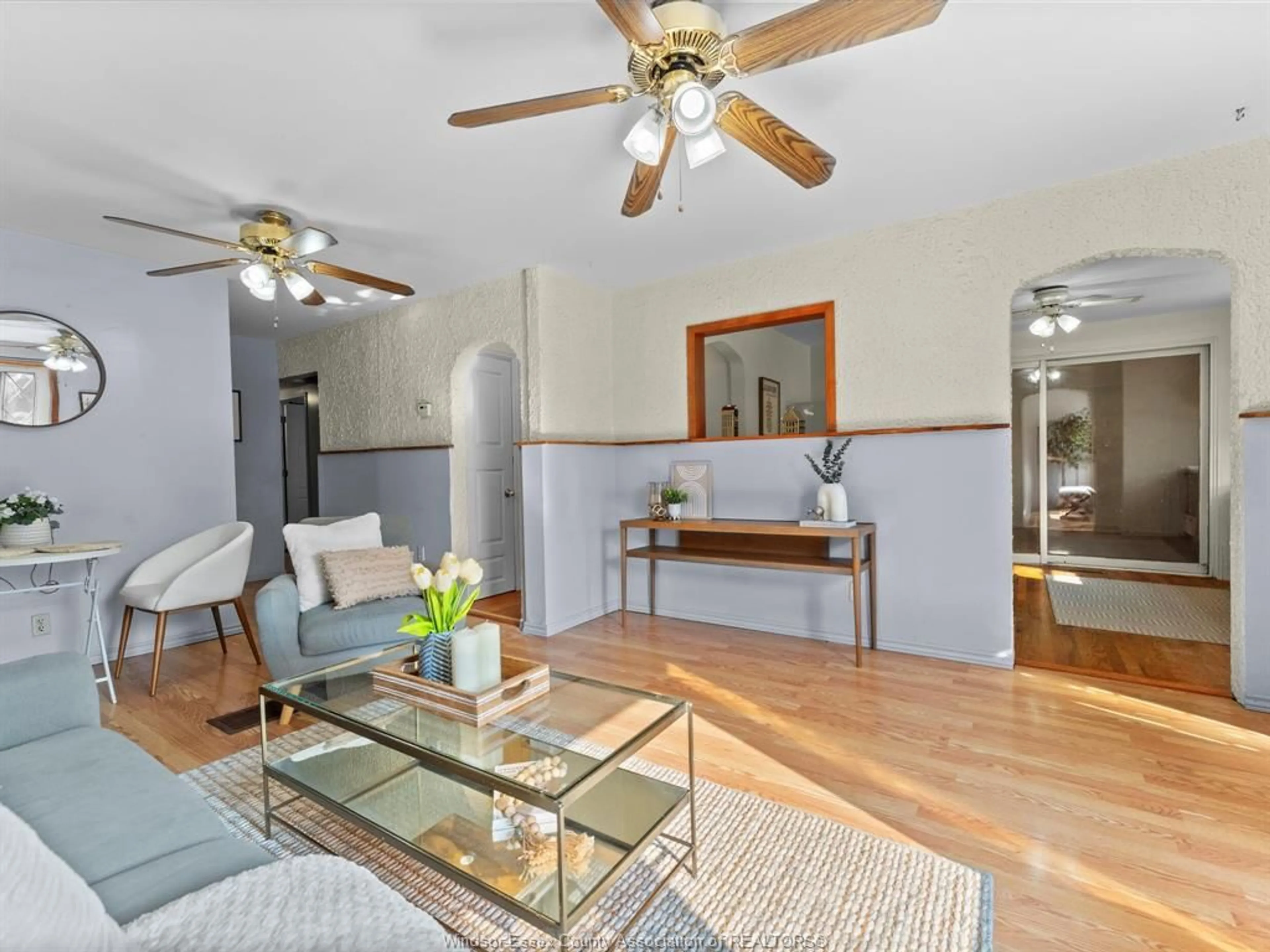 Living room with furniture, wood/laminate floor for 1561 Drouillard Rd, Windsor Ontario N8Y 2S1