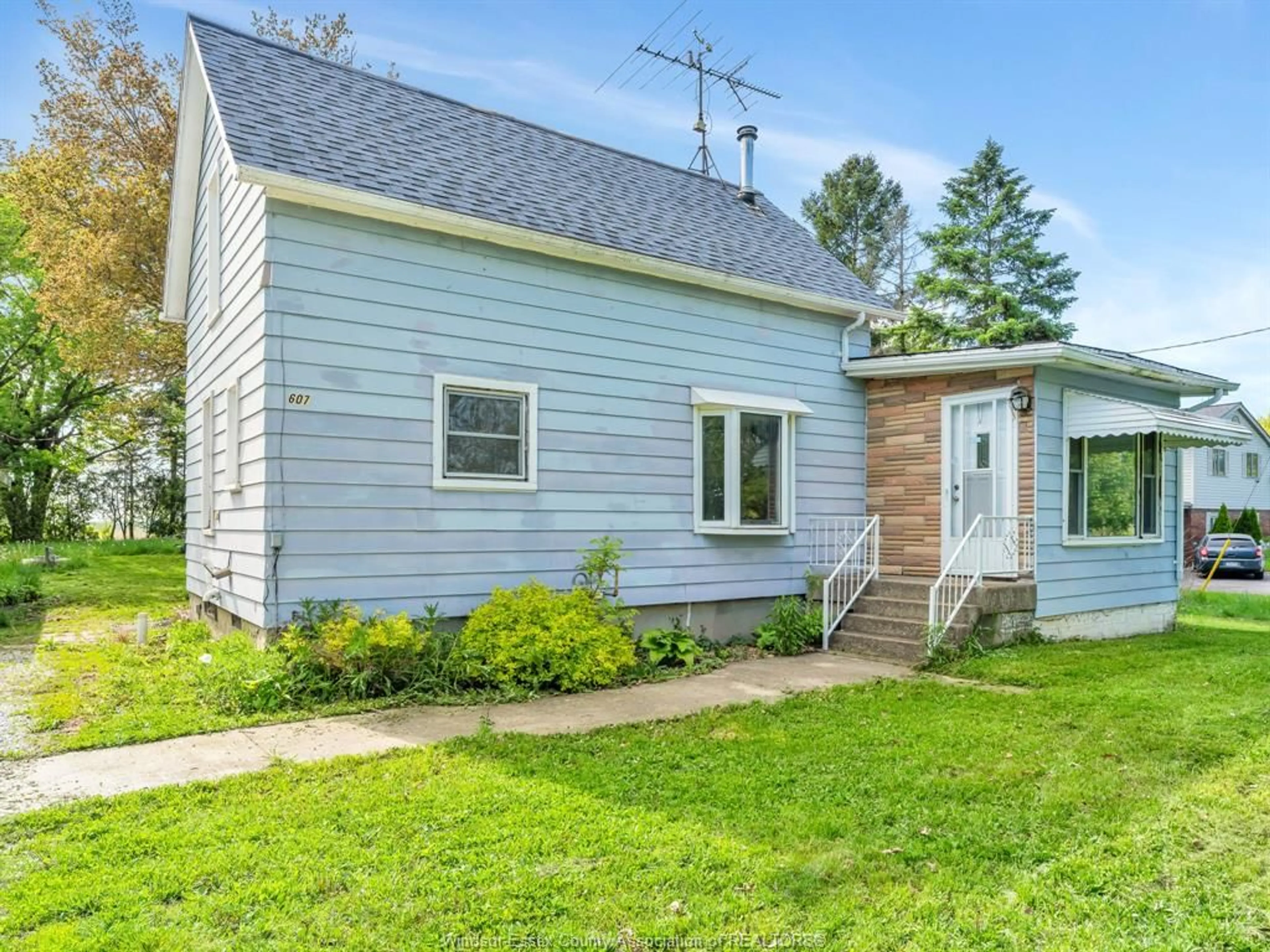 Home with vinyl exterior material, street for 607 WEST BELLE RIVER Rd, Lakeshore Ontario N0R 1A0