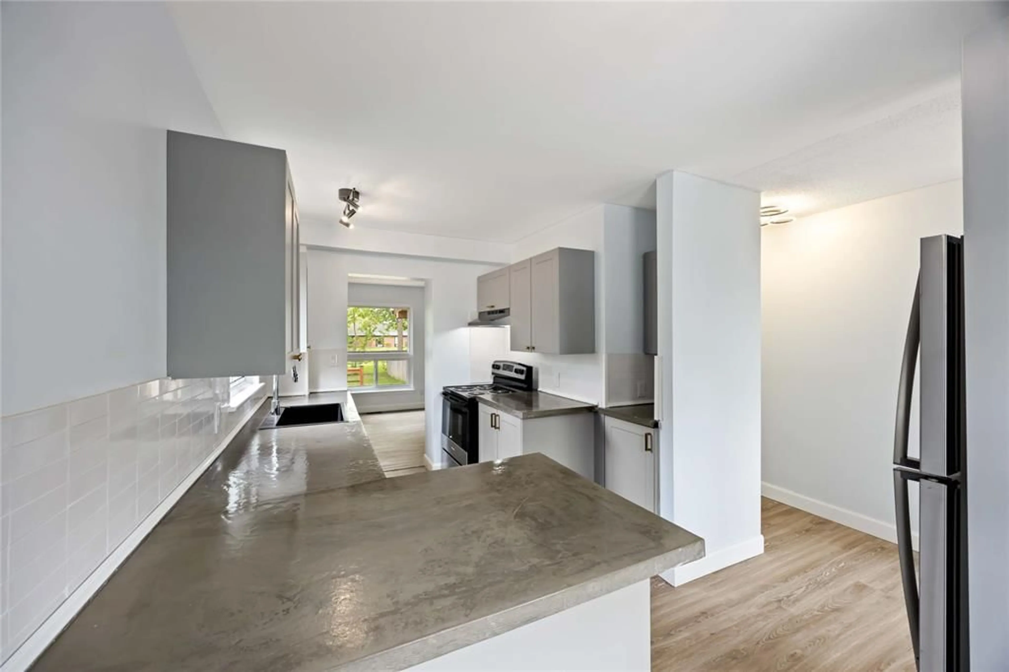 Open concept kitchen, cement floor for 110 FAIRVIEW Pl, Sarnia Ontario N7S 4E1