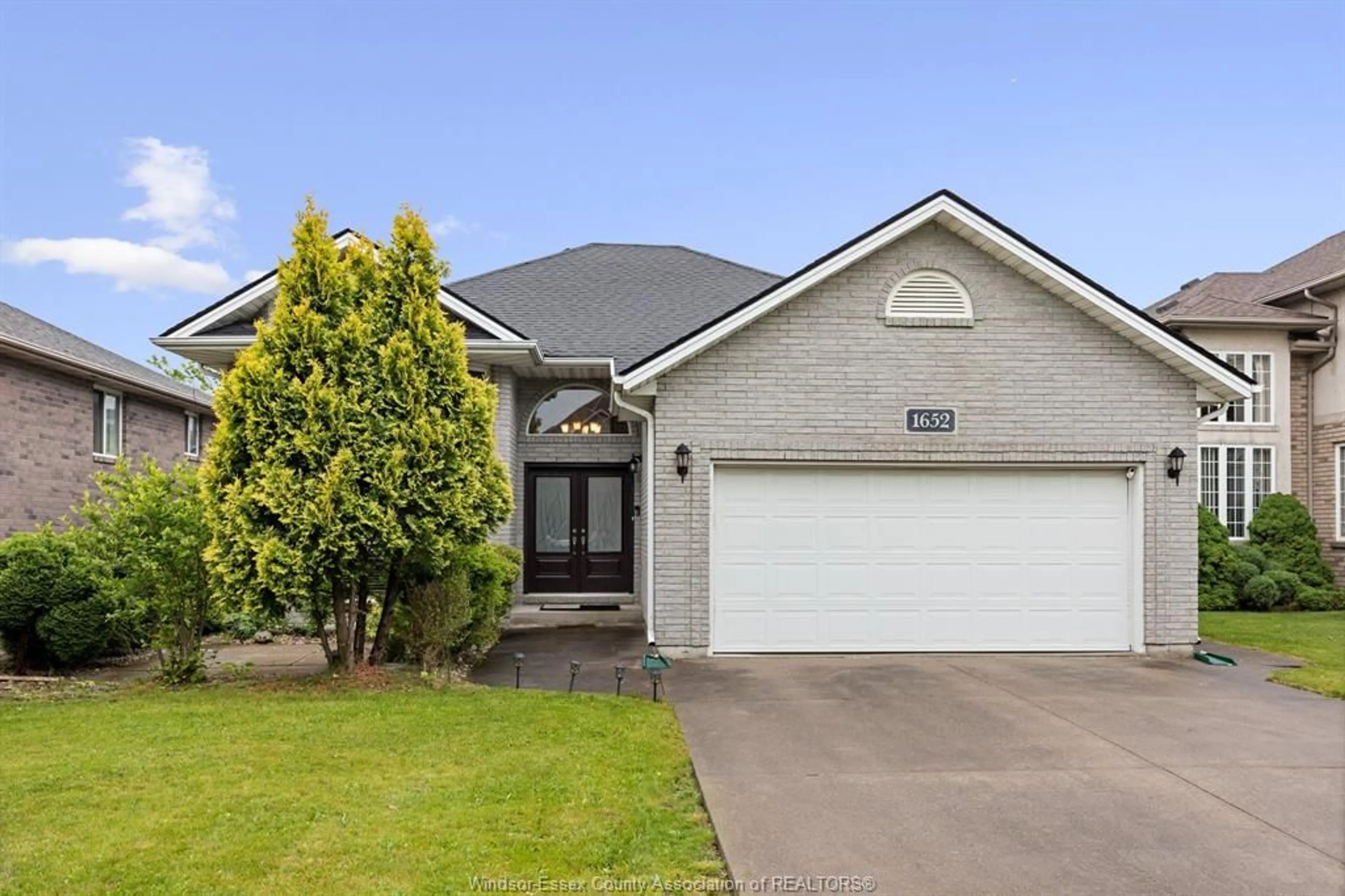 Home with brick exterior material, street for 1652 Stoneybrook Cres, Windsor Ontario N9G 2S9