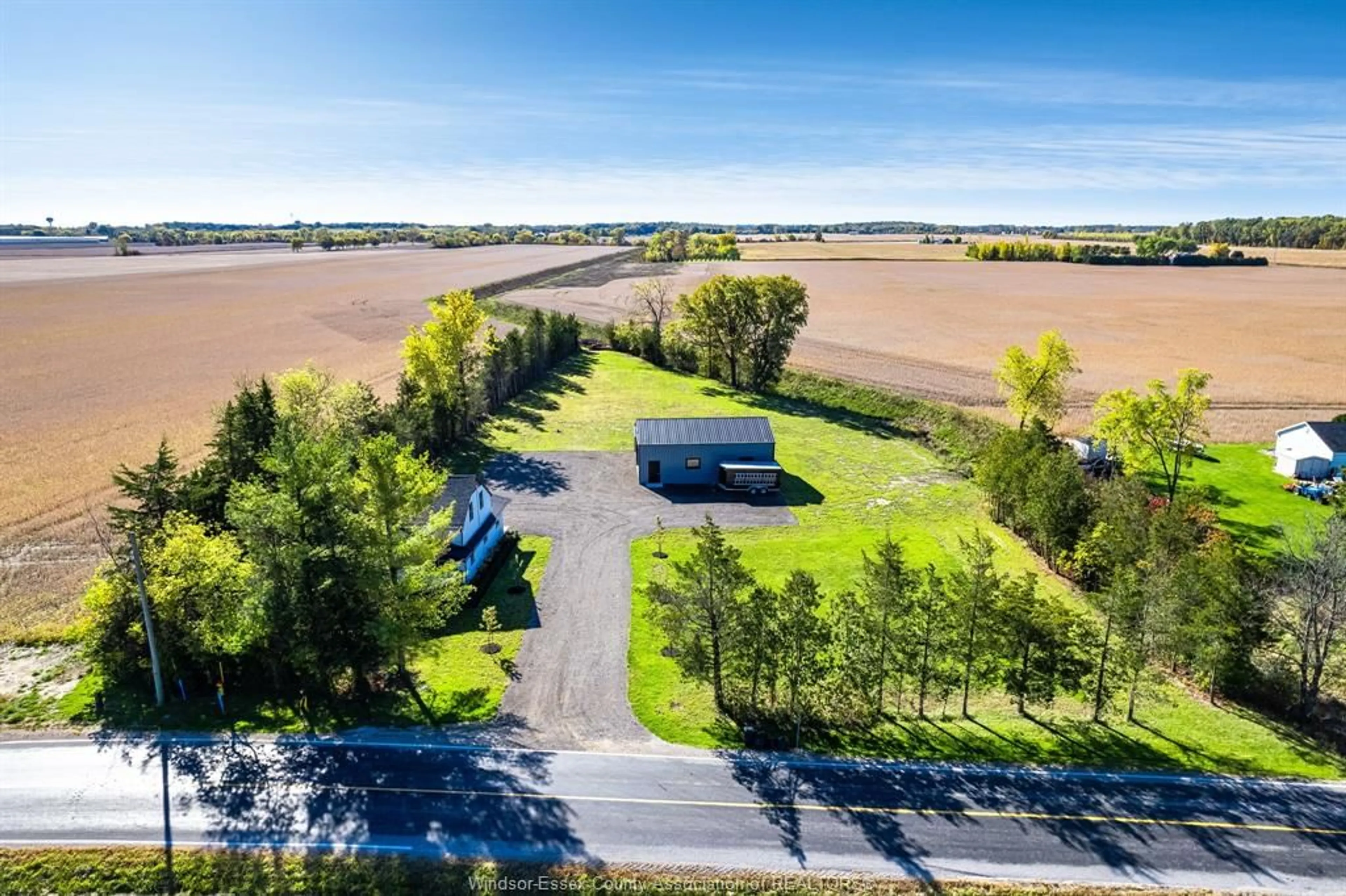 A pic from outside/outdoor area/front of a property/back of a property/a pic from drone, water/lake/river/ocean view for 2214 Mersea Road 7, Leamington Ontario N0P 2P0