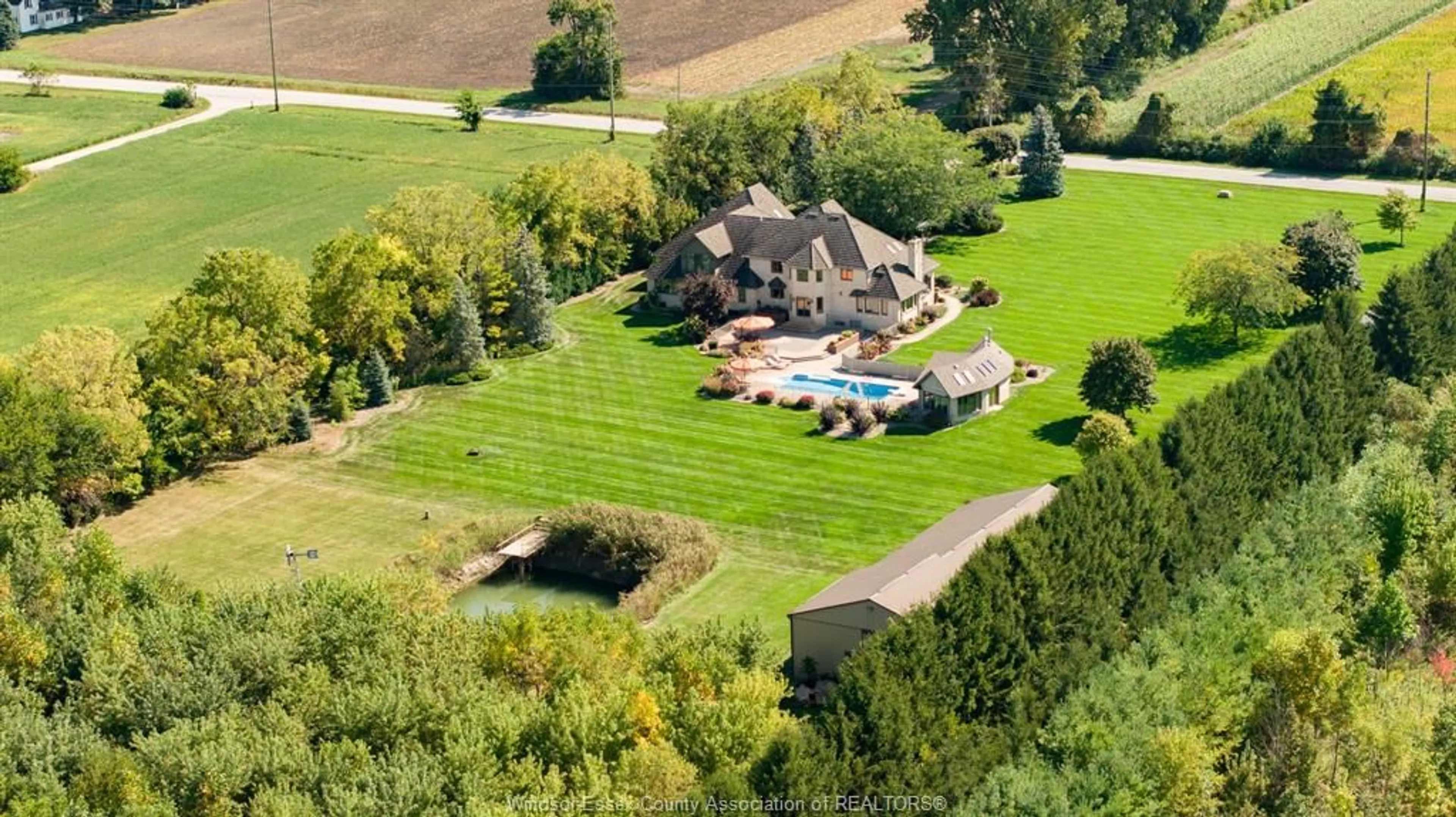 A pic from outside/outdoor area/front of a property/back of a property/a pic from drone, unknown for 1020 Road 6, Kingsville Ontario N9Y 2E9