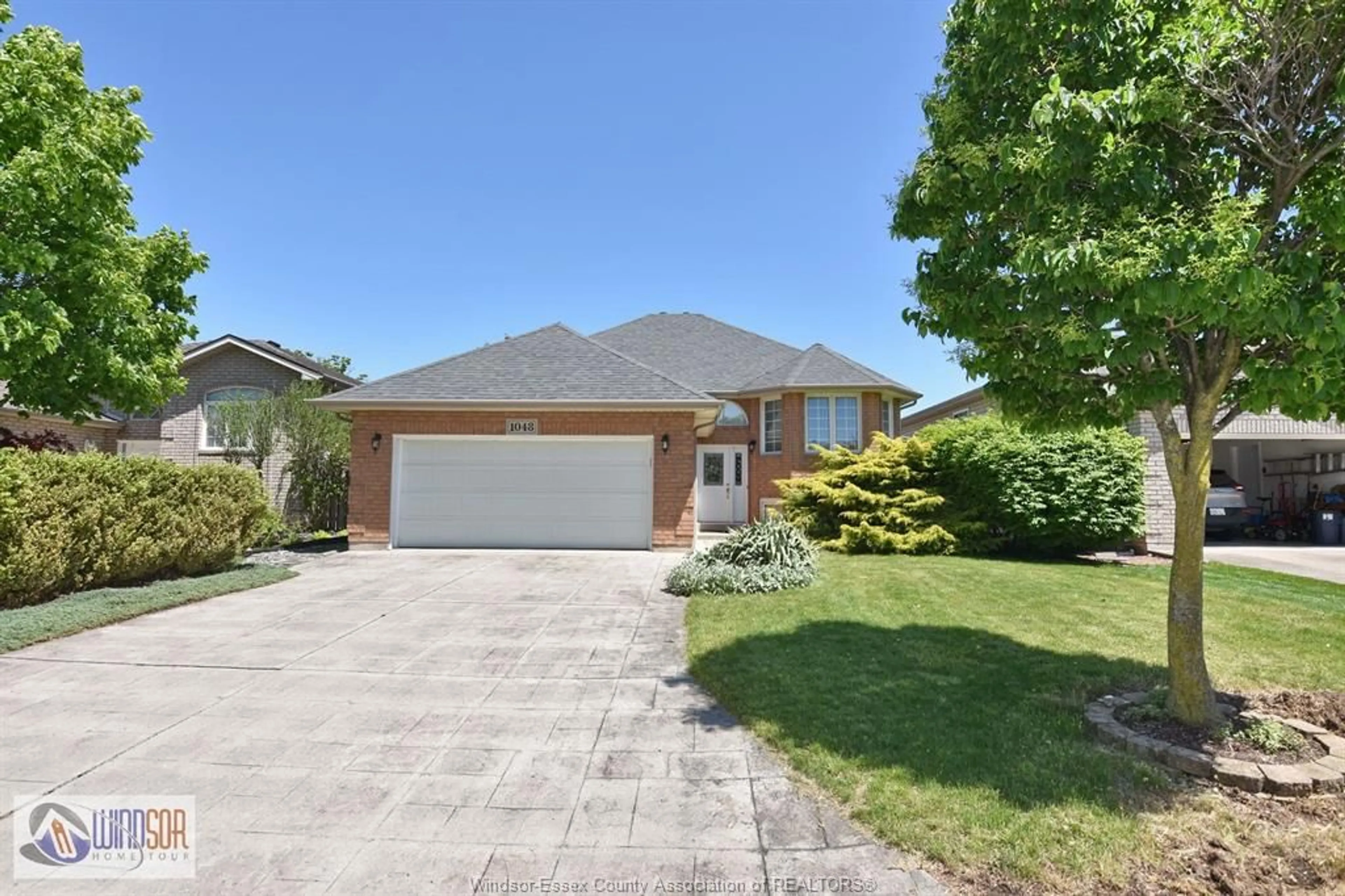 A pic from outside/outdoor area/front of a property/back of a property/a pic from drone, street for 1048 BELLAGIO, Windsor Ontario N8P 1J6