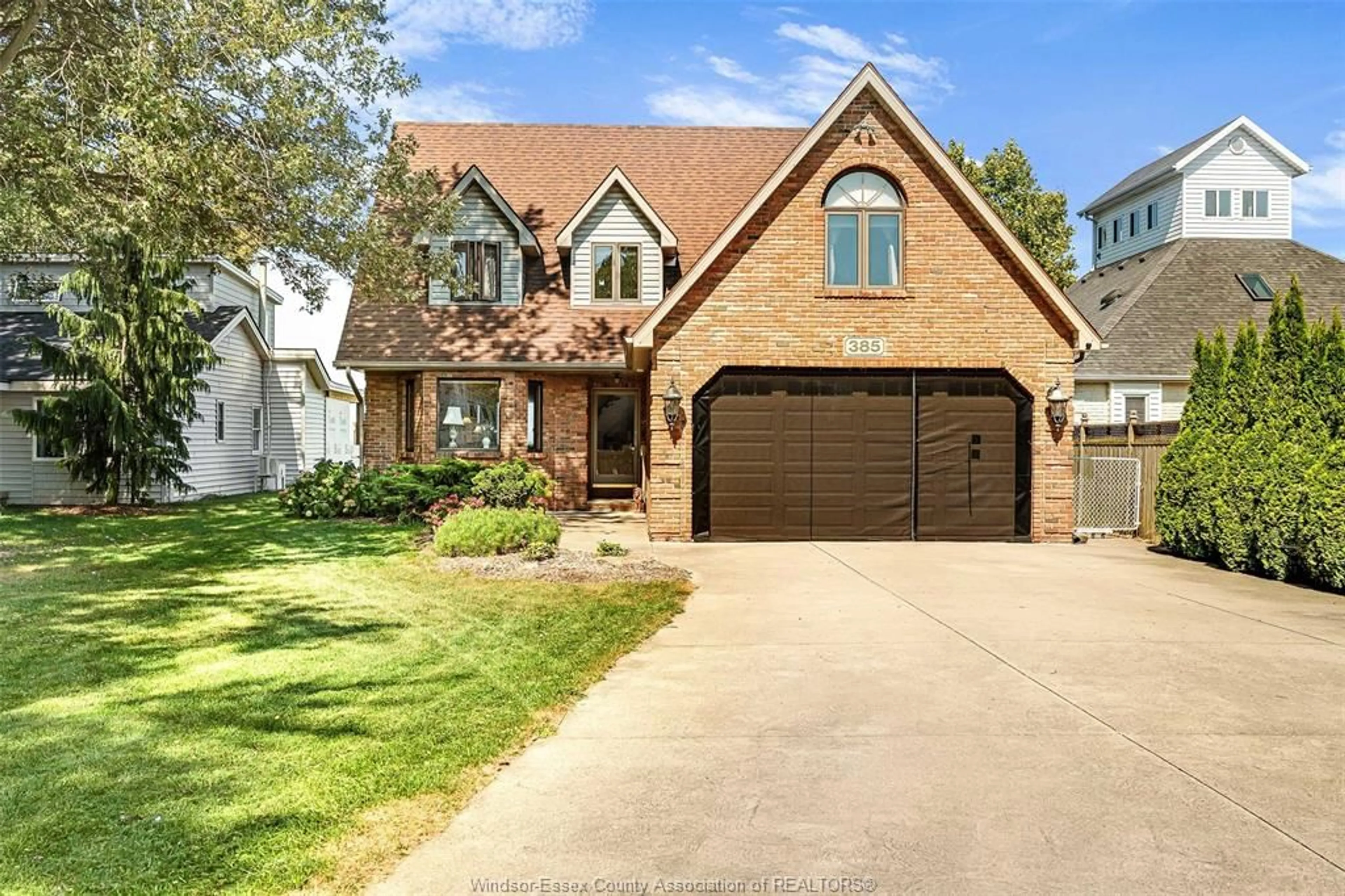 Home with brick exterior material, street for 385 LAKEVIEW Dr, Lakeshore Ontario N0R 1A0