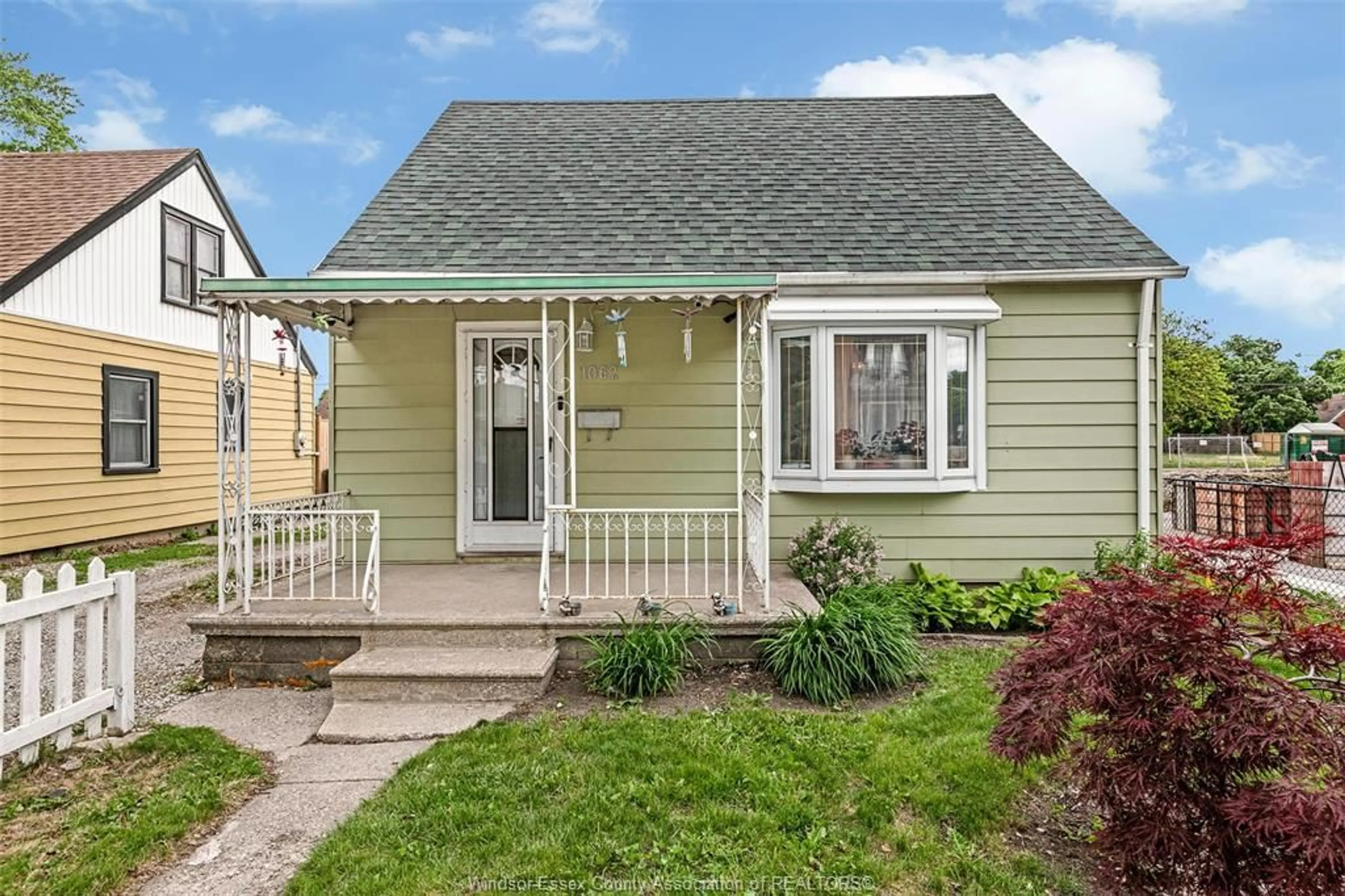 Home with vinyl exterior material, street for 1062 CALIFORNIA Ave, Windsor Ontario N9B 2Z7
