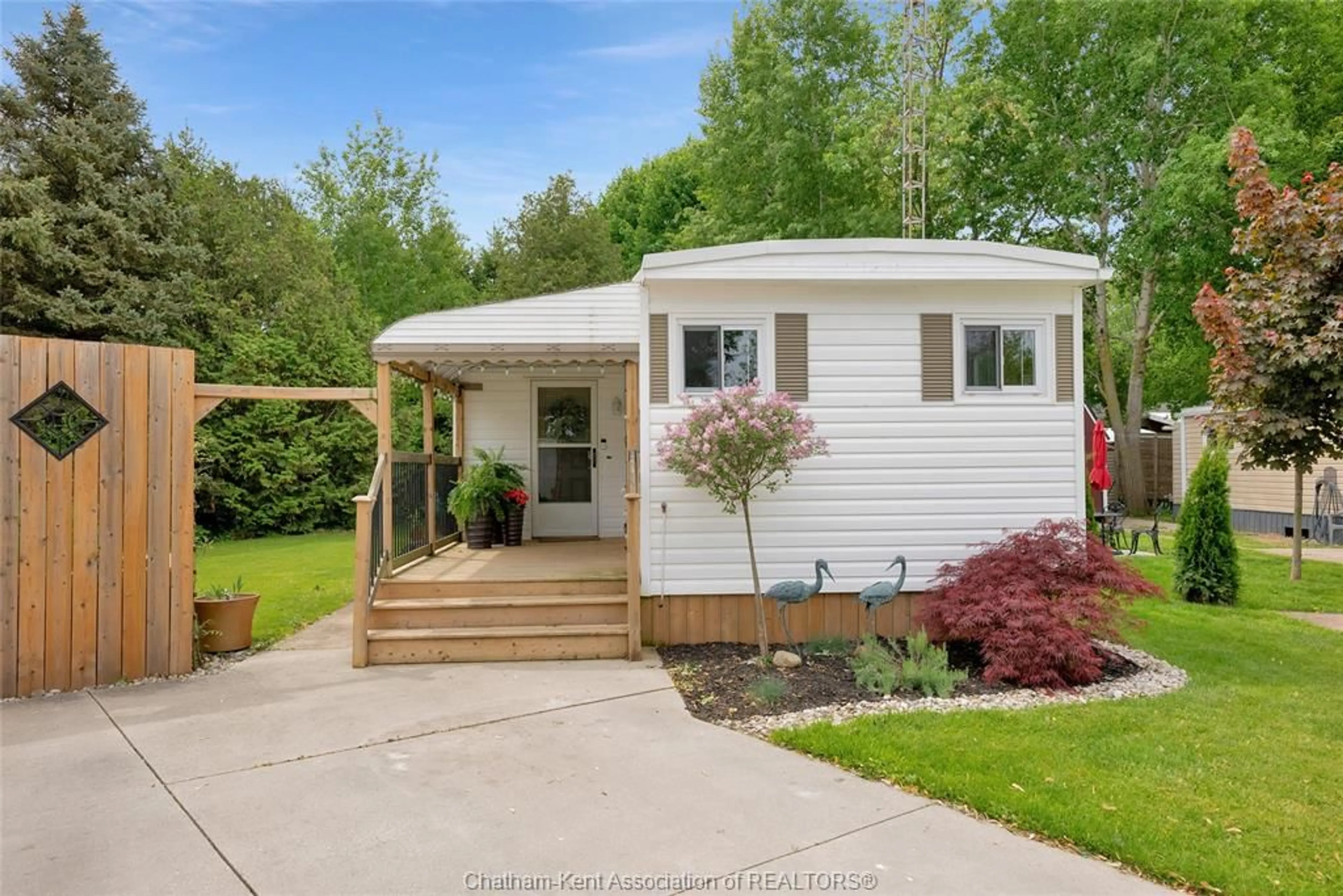 Home with vinyl exterior material, street for 22220 Charing Cross Rd #16, Chatham Ontario N7M 5V8