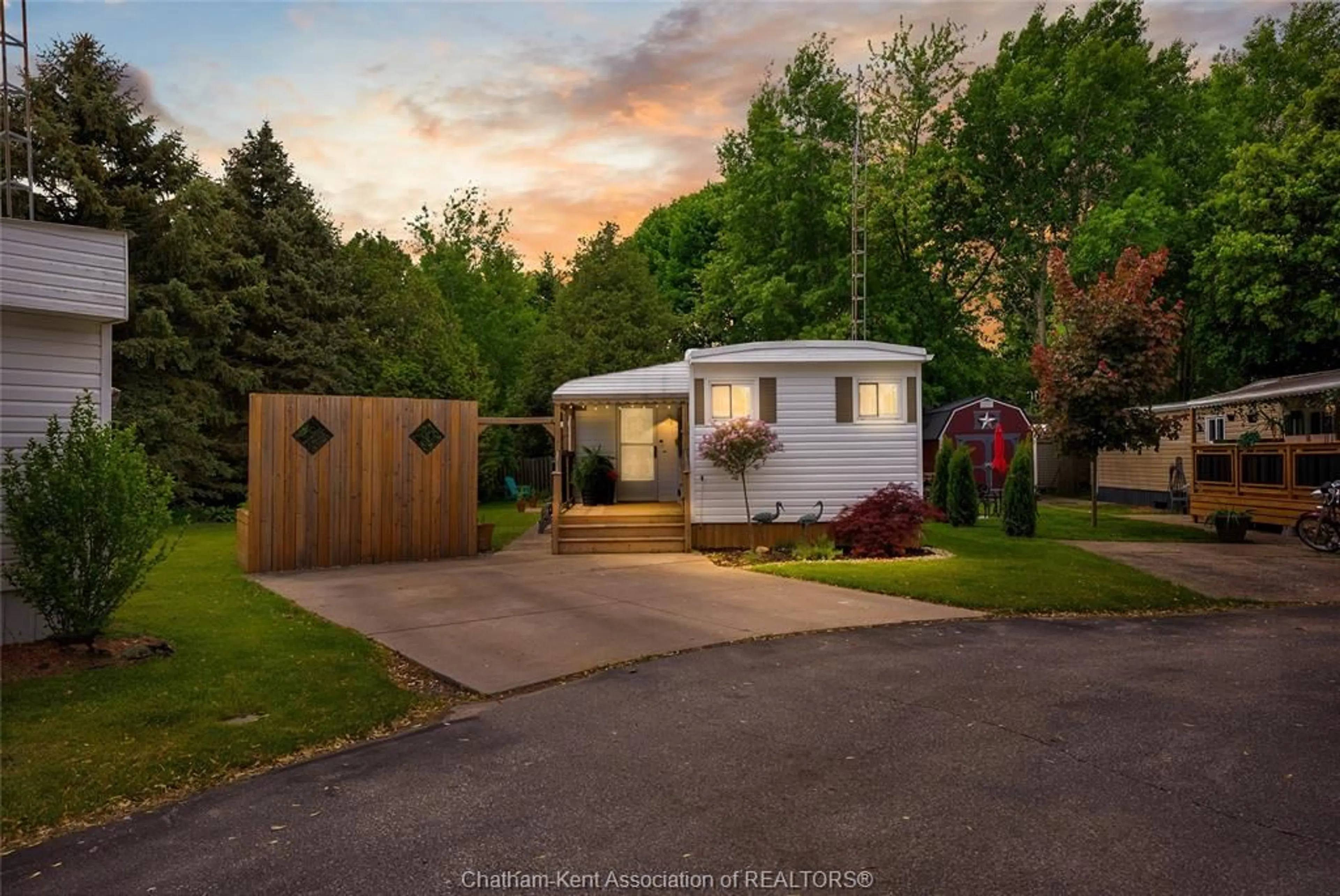 Home with vinyl exterior material, street for 22220 Charing Cross Rd #16, Chatham Ontario N7M 5V8