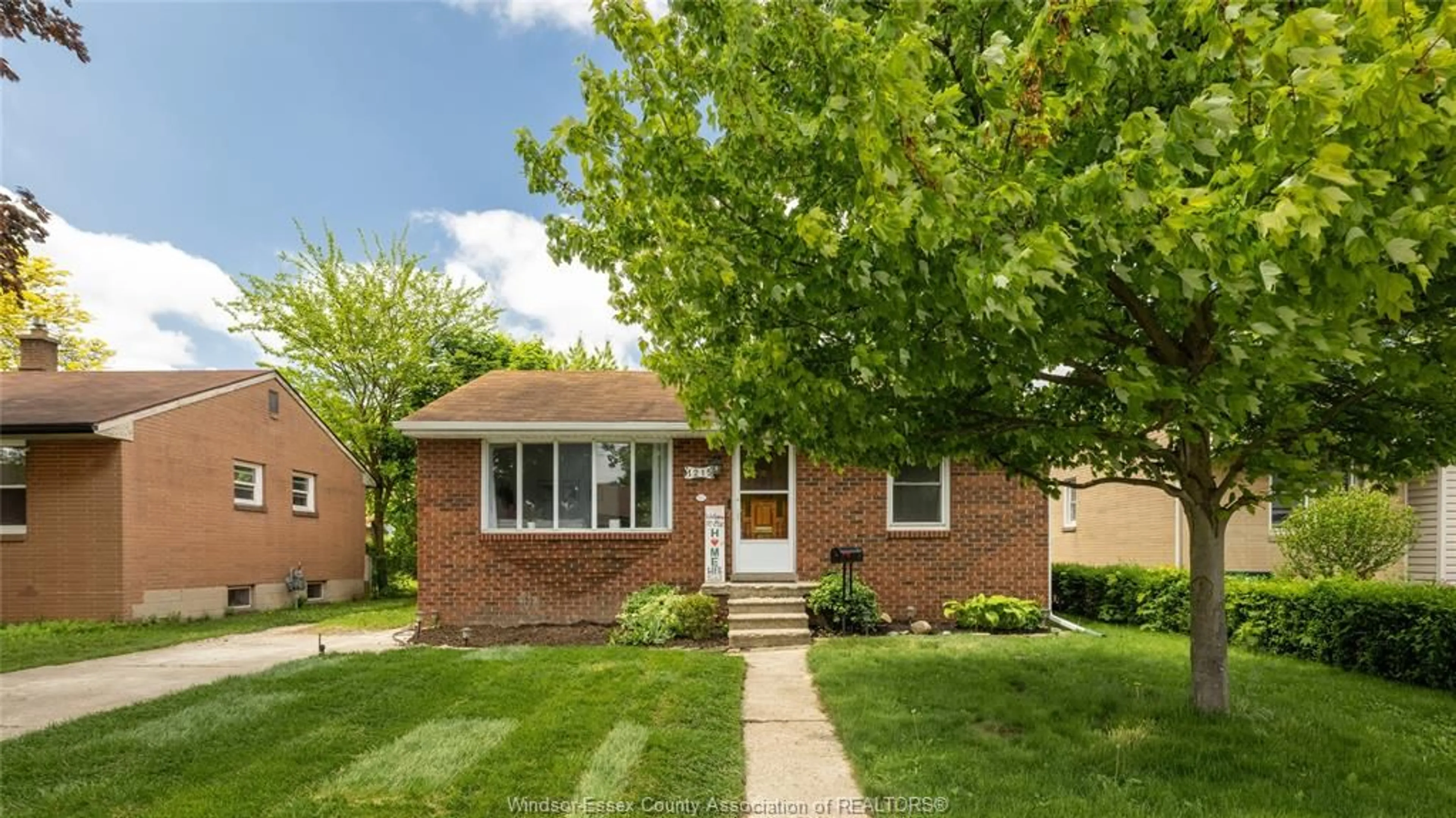 Home with brick exterior material, street for 1215 DOT Ave, Windsor Ontario N9C 3H9