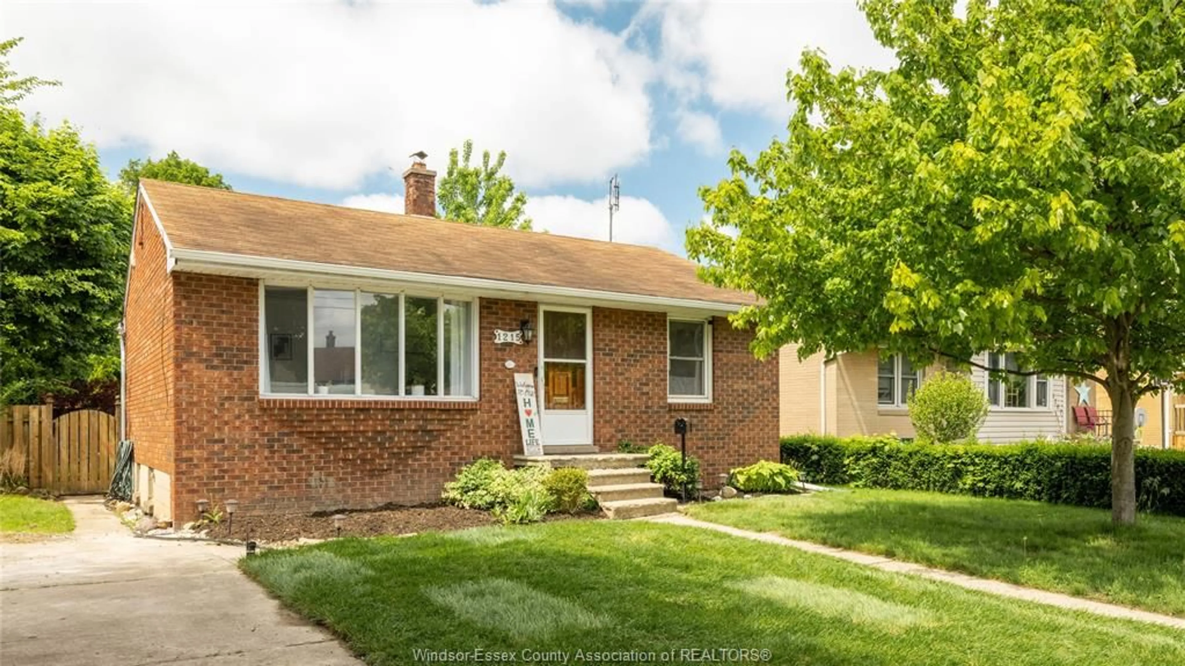 Home with brick exterior material, street for 1215 DOT Ave, Windsor Ontario N9C 3H9