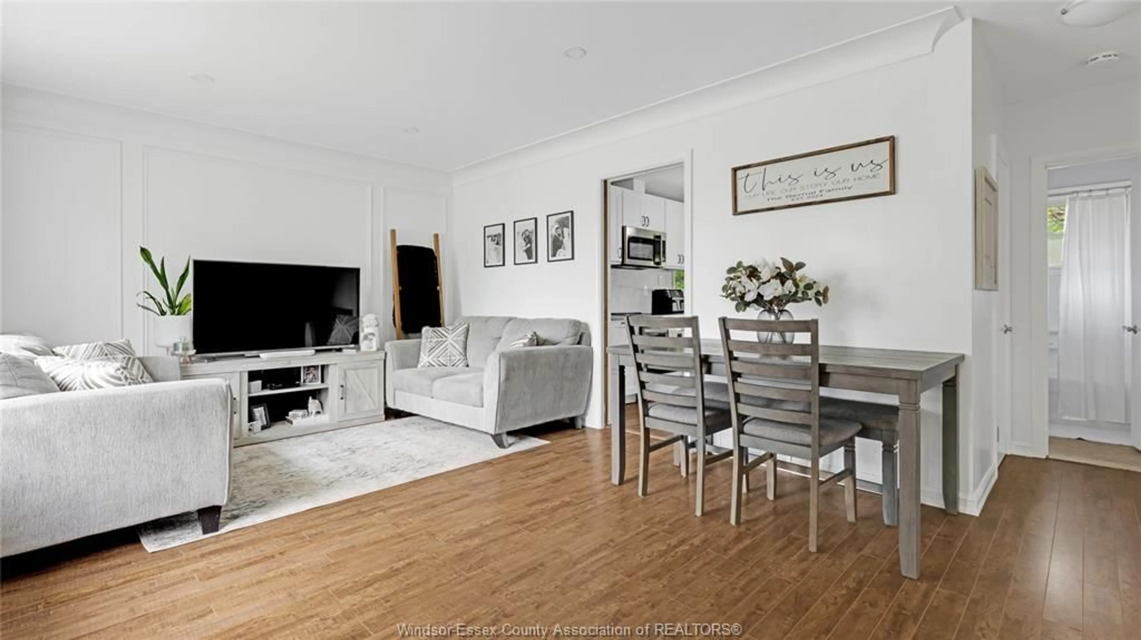 Living room with furniture, wood/laminate floor for 1215 DOT Ave, Windsor Ontario N9C 3H9
