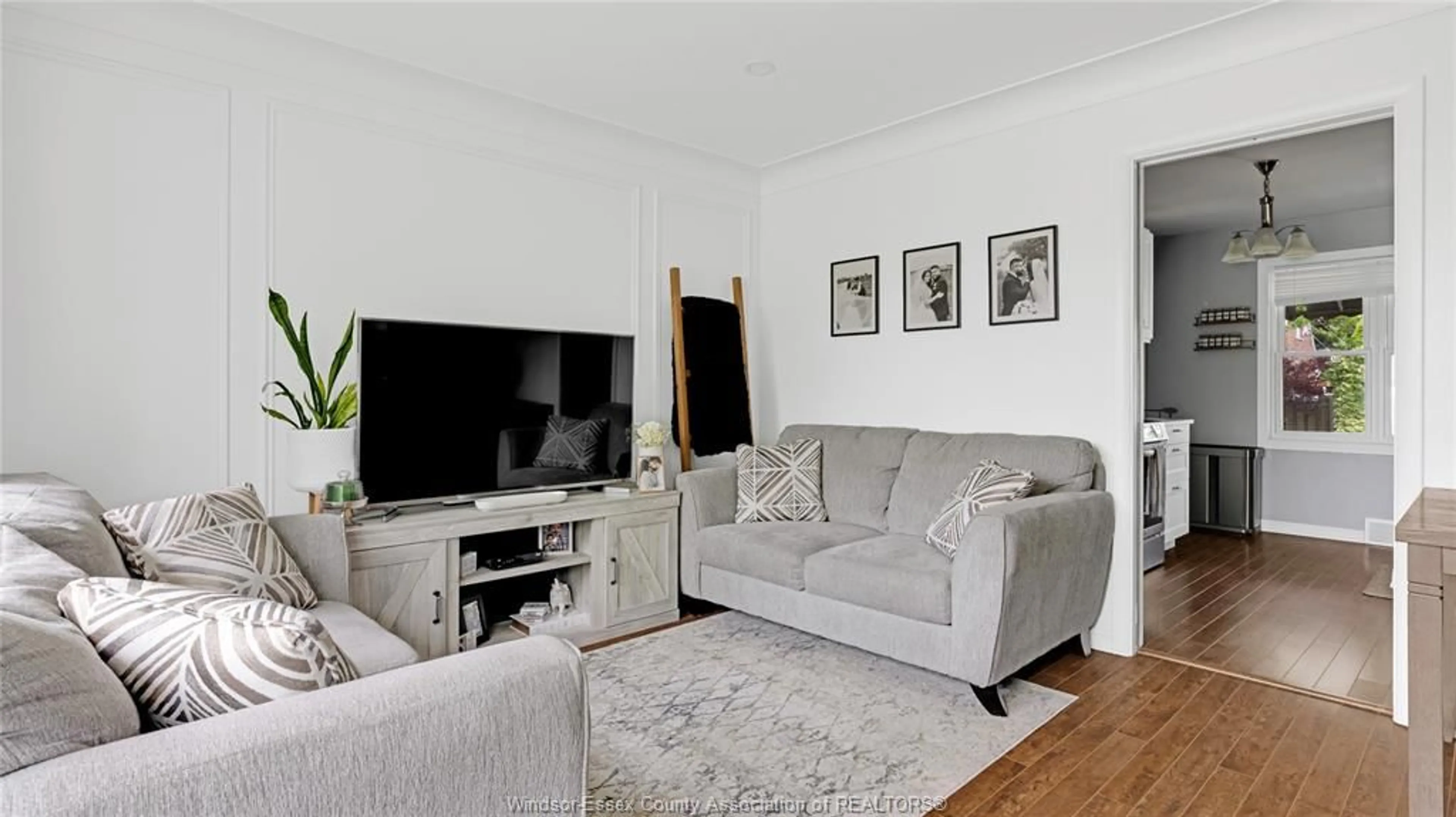 Living room with furniture, wood/laminate floor for 1215 DOT Ave, Windsor Ontario N9C 3H9
