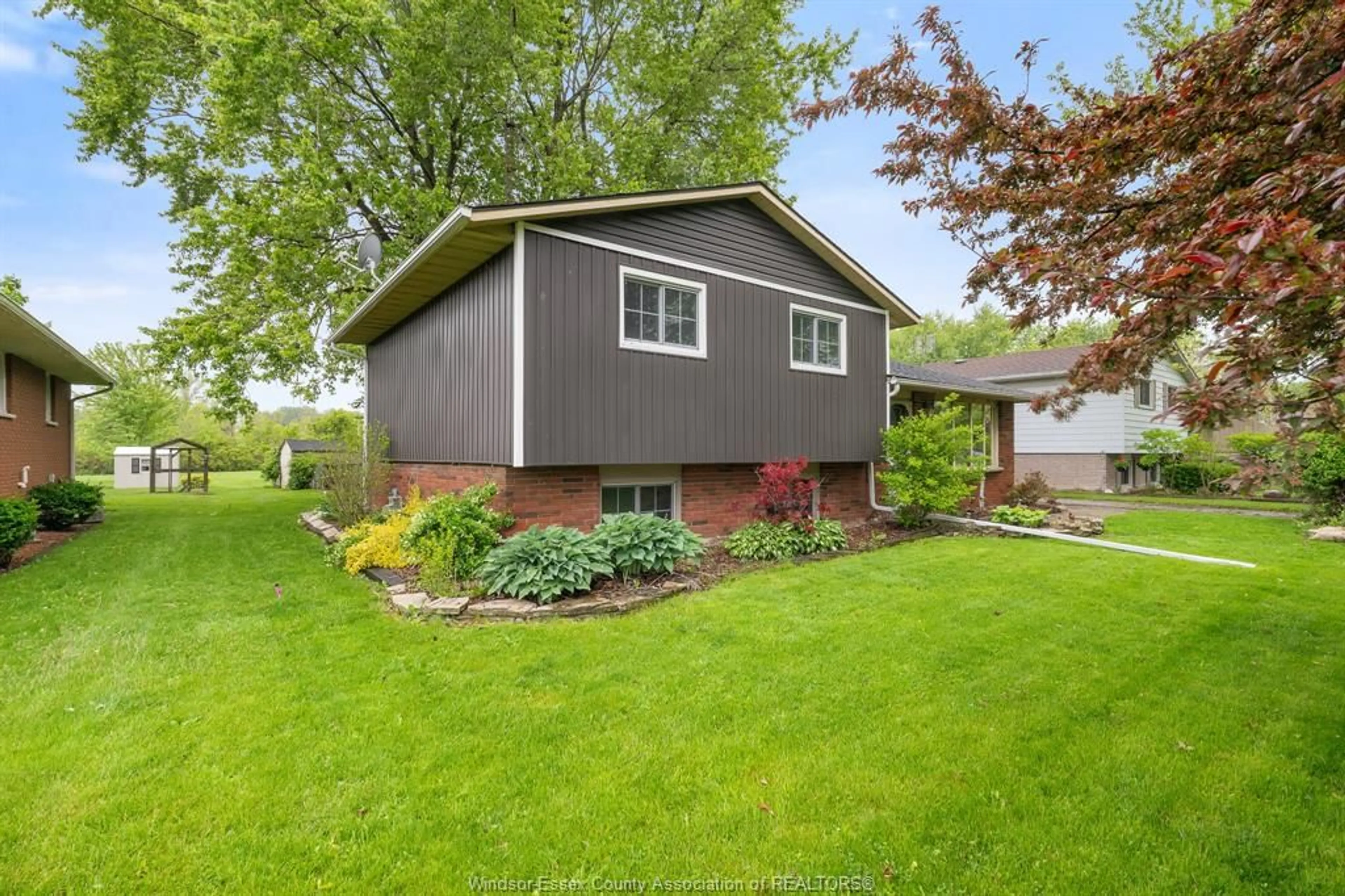 Home with vinyl exterior material, street for 21196 Pier Rd, Wheatley Ontario N0P 2P0