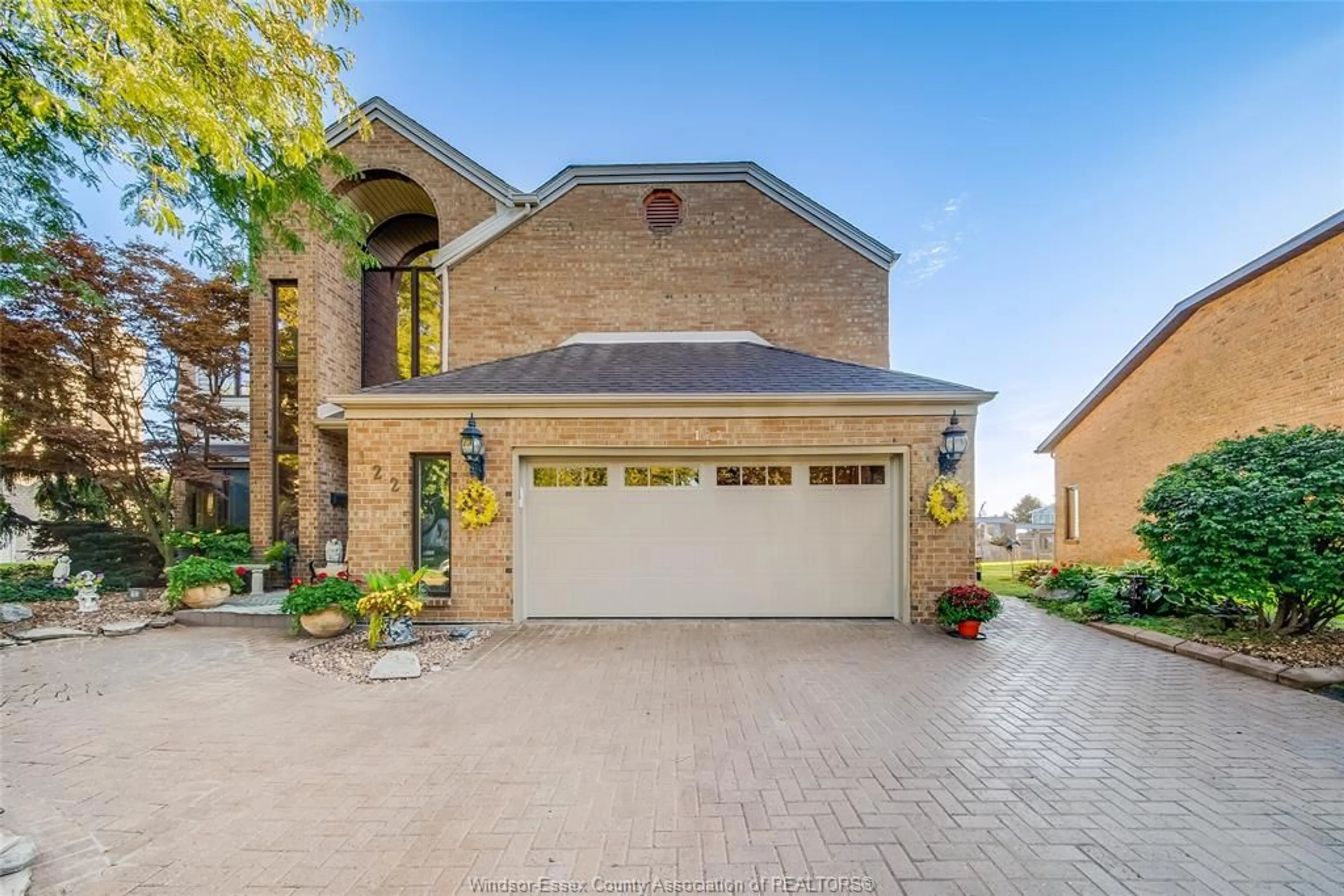 Home with brick exterior material, street for 122 COVE Dr, Tecumseh Ontario N8N 3W2