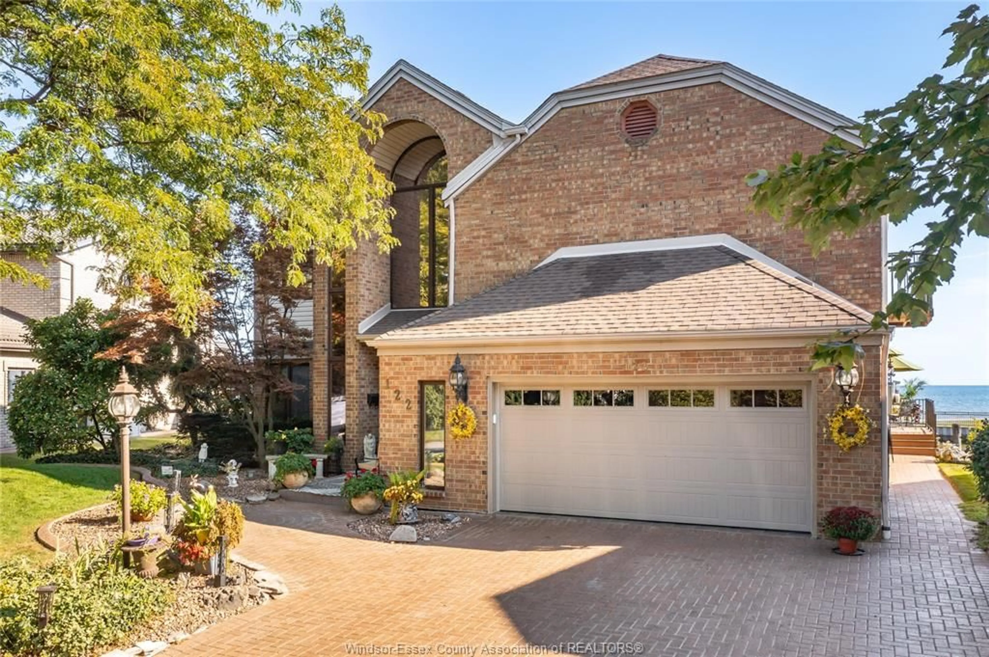 Home with brick exterior material, street for 122 COVE Dr, Tecumseh Ontario N8N 3W2