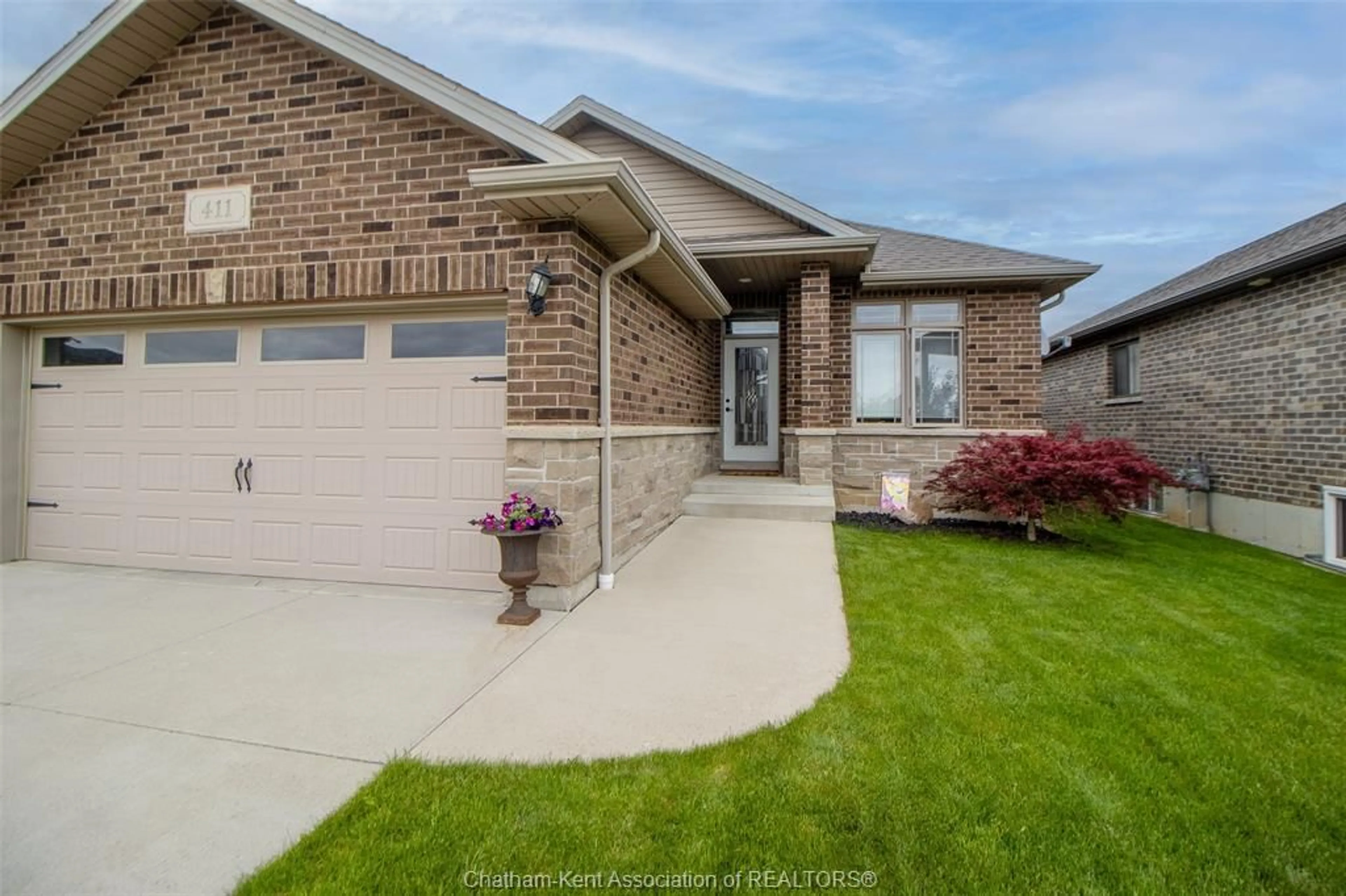 Home with brick exterior material, street for 411 TWILIGHT Trail, Chatham Ontario N7L 0B9