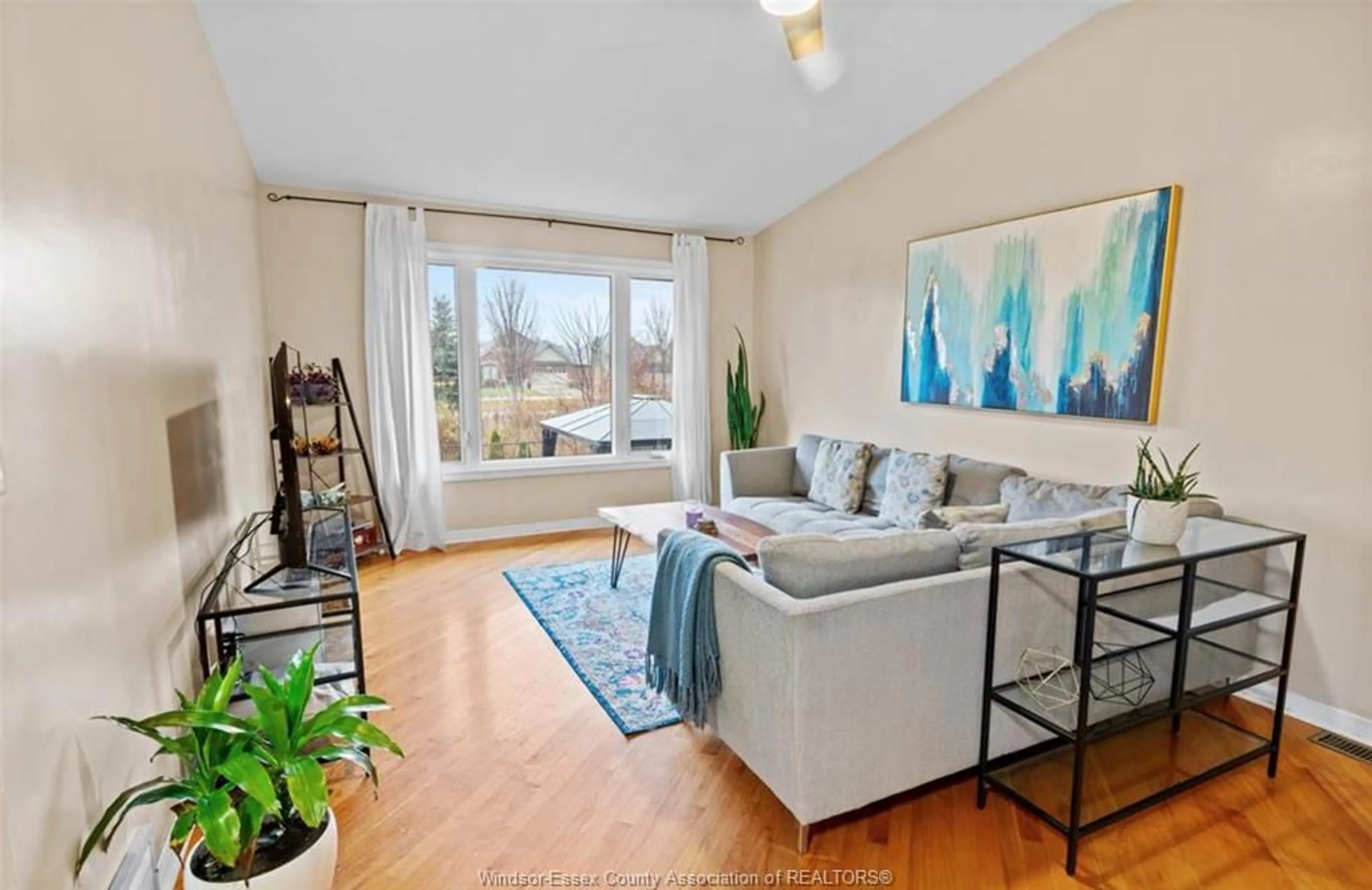 Living room with furniture, wood/laminate floor for 2076 EDGEMORE, LaSalle Ontario N9H 2E1