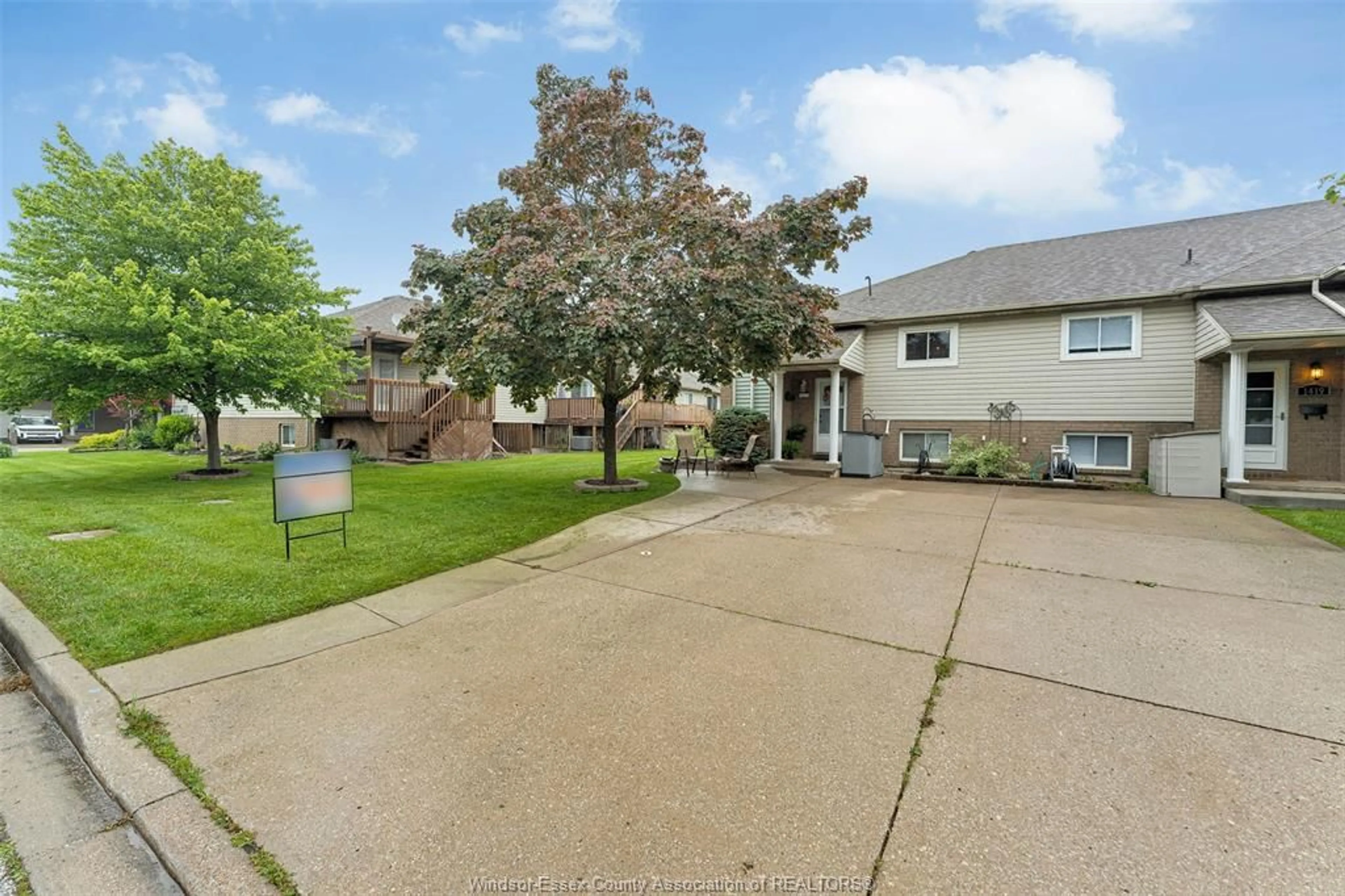 A pic from outside/outdoor area/front of a property/back of a property/a pic from drone, street for 1417 MICKAILA, Tecumseh Ontario N8N 4Z2