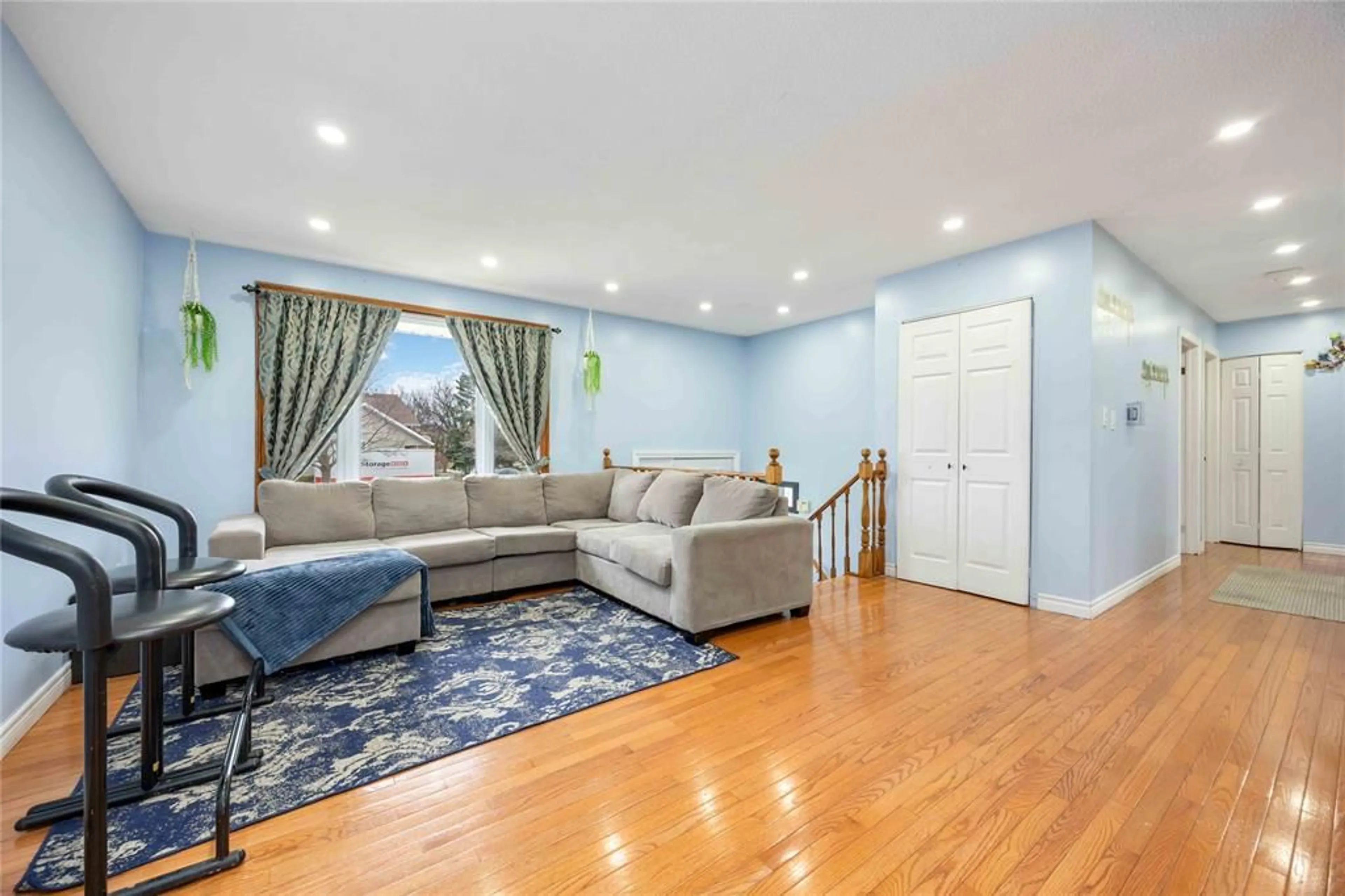 Living room with furniture, wood/laminate floor for 772 CARDIFF Dr, Sarnia Ontario N7S 4X9