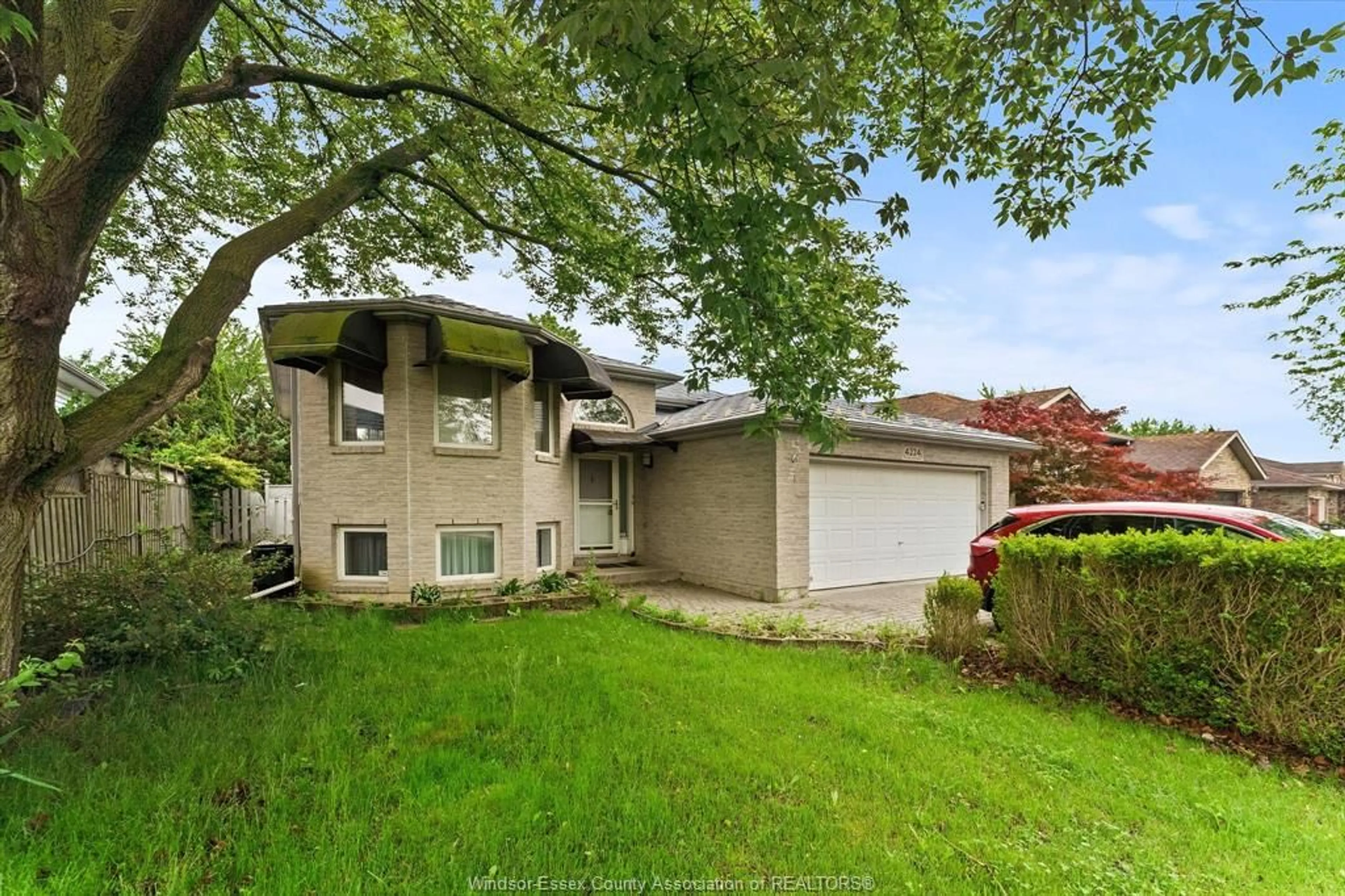 A pic from outside/outdoor area/front of a property/back of a property/a pic from drone, street for 4224 NORTHWOOD LAKES Dr, Windsor Ontario N9G 2W2