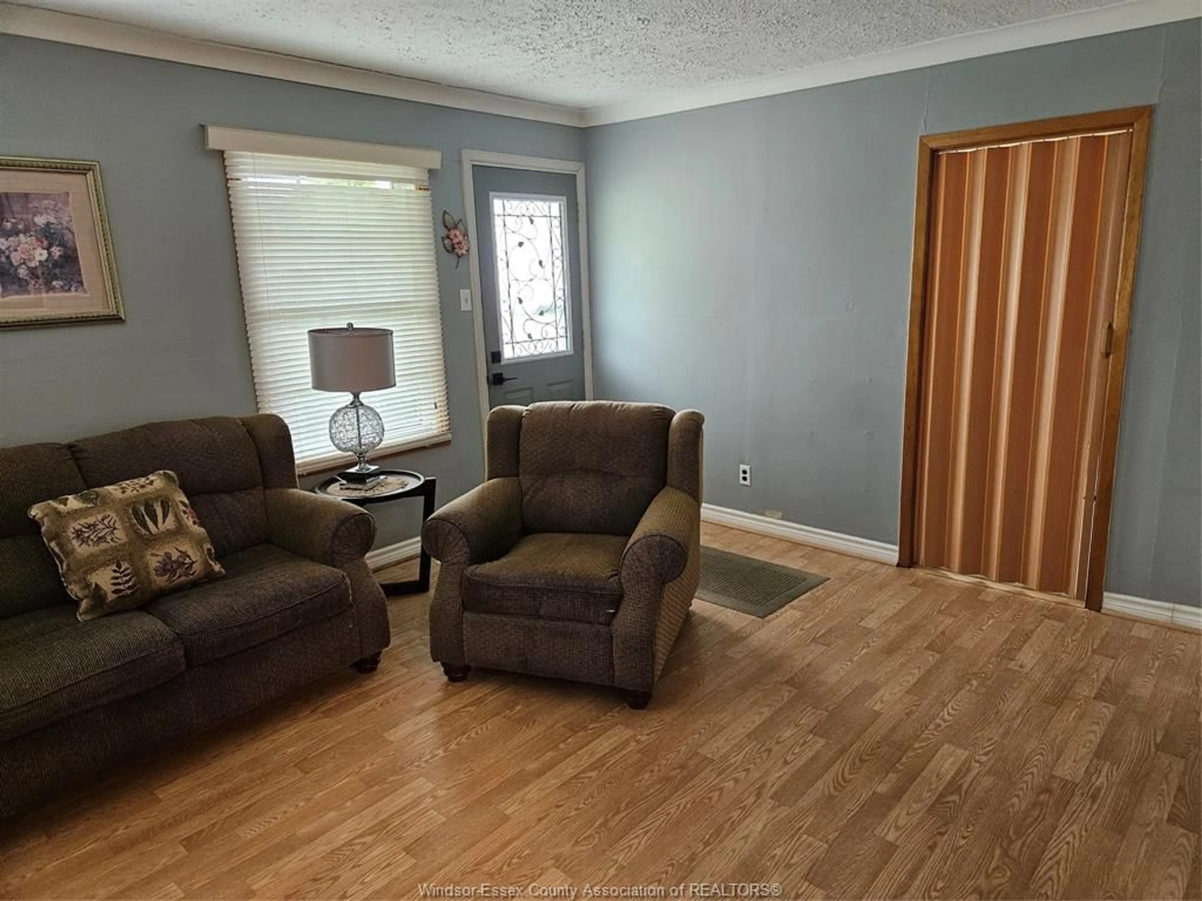 Living room with furniture, wood/laminate floor for 1709 CENTRAL, Windsor Ontario N8Y 3W3