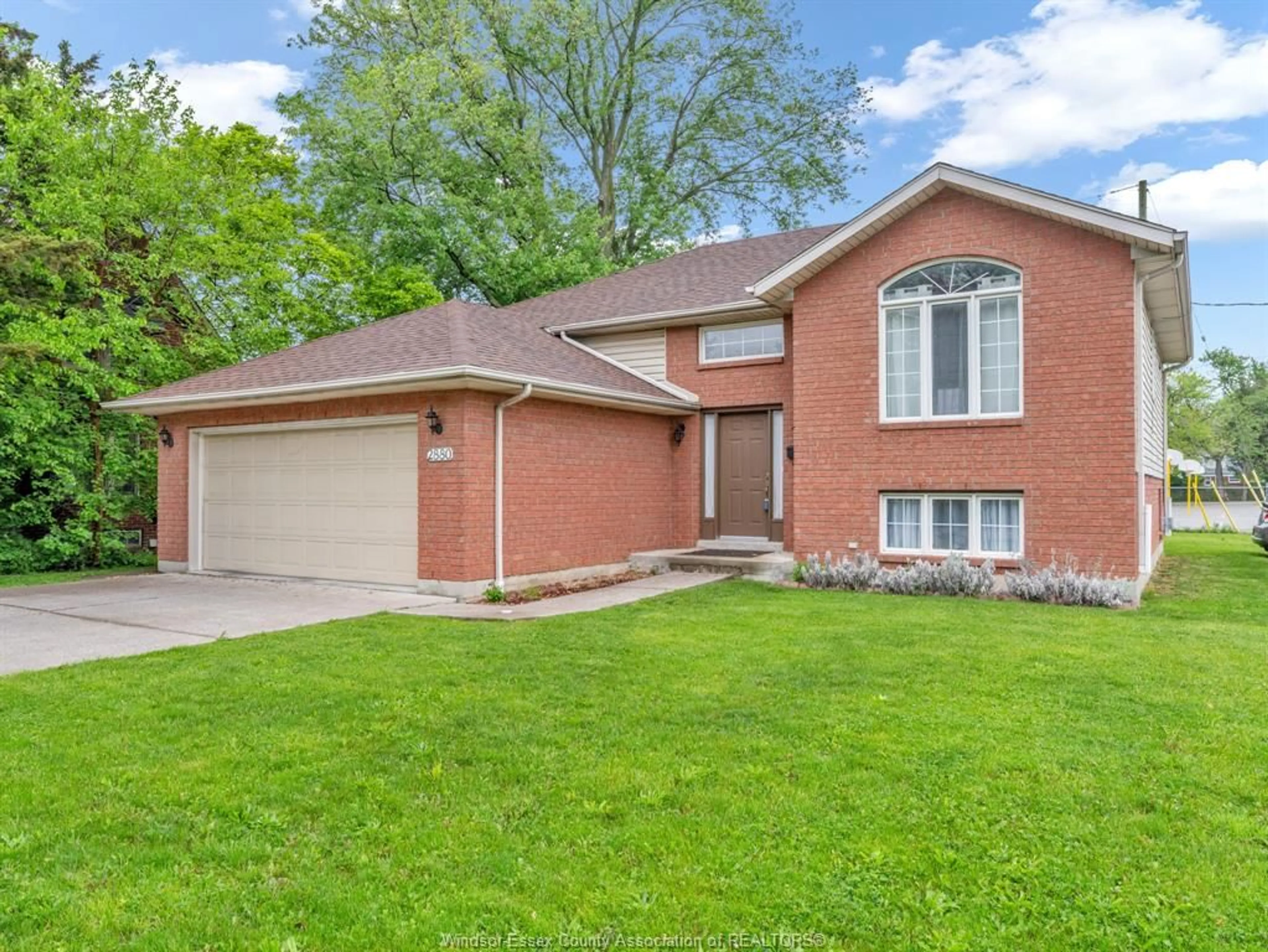 Home with brick exterior material, street for 2880 DOMINION Blvd, Windsor Ontario N9E 2M8