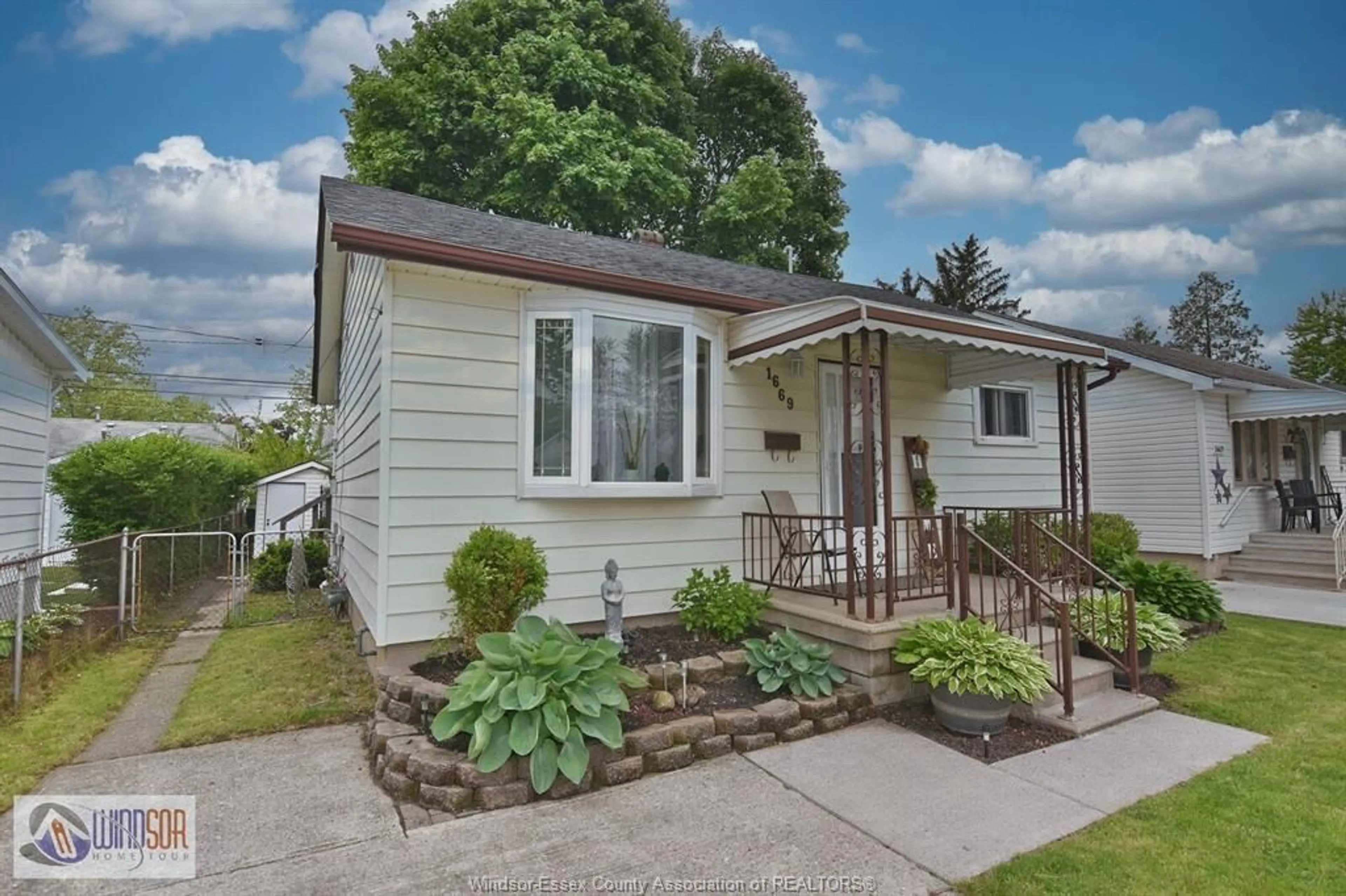 Home with vinyl exterior material, street for 1669 TOURANGEAU, Windsor Ontario N8Y 4J7