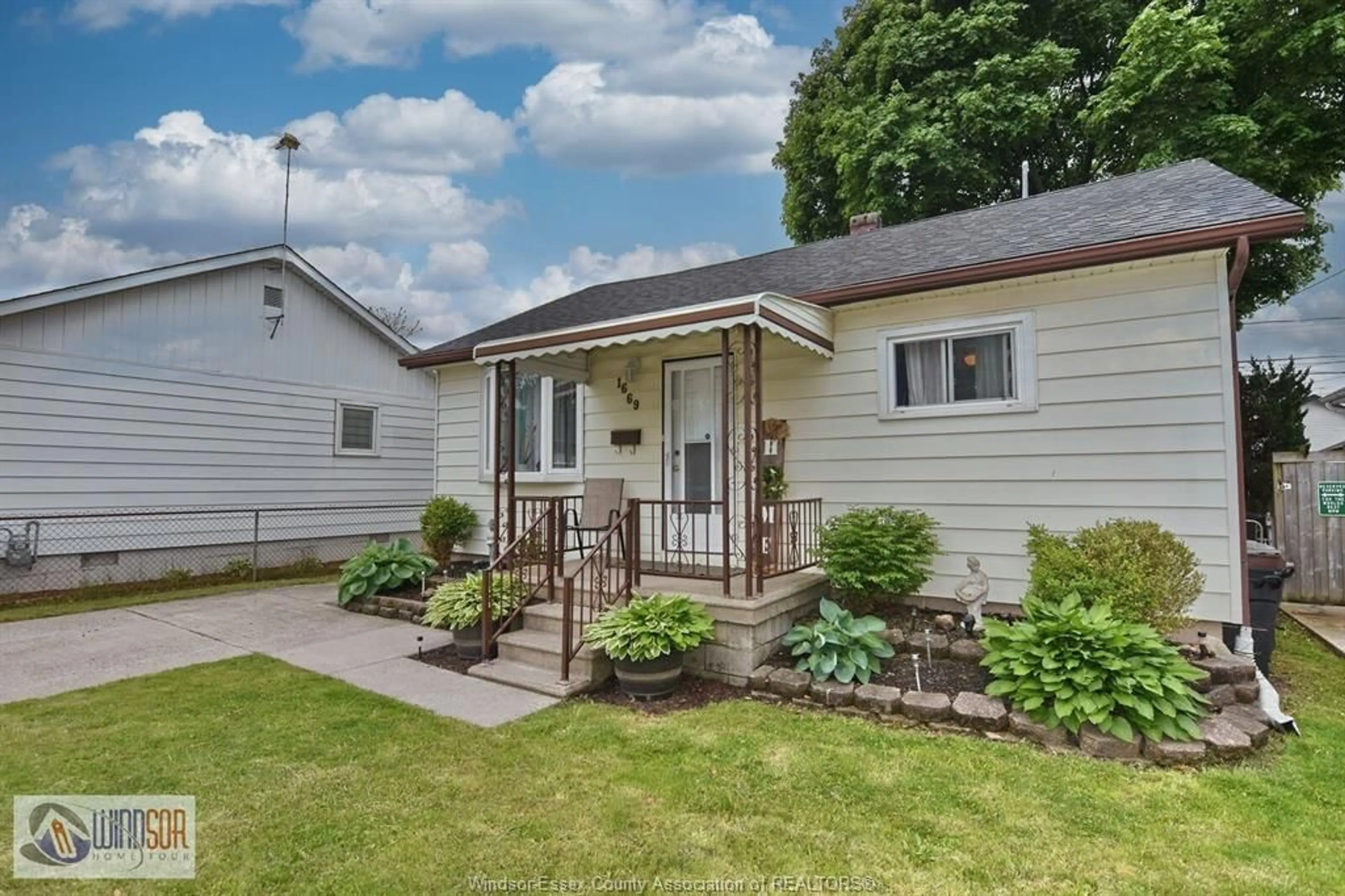 Home with vinyl exterior material, street for 1669 TOURANGEAU, Windsor Ontario N8Y 4J7